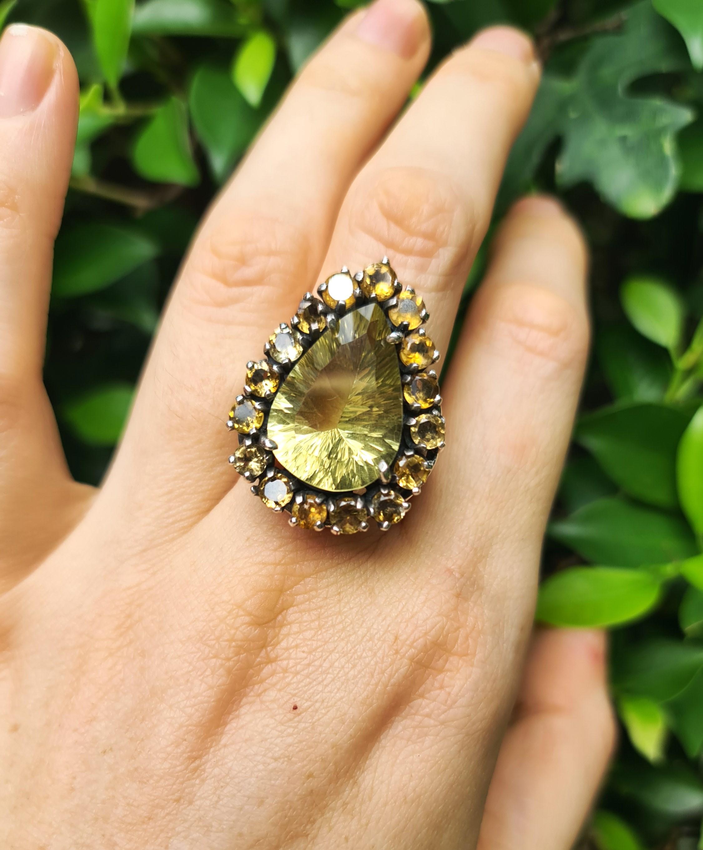 925 Sterling Silver Ring with large pear shape lemon quartz in the middle and citrine gemstones around.

The ring size is 7 1/4 US
Please, request your size. We can resize any size for you.

The size of the pear shape Lemon Quartz stone is 15×22