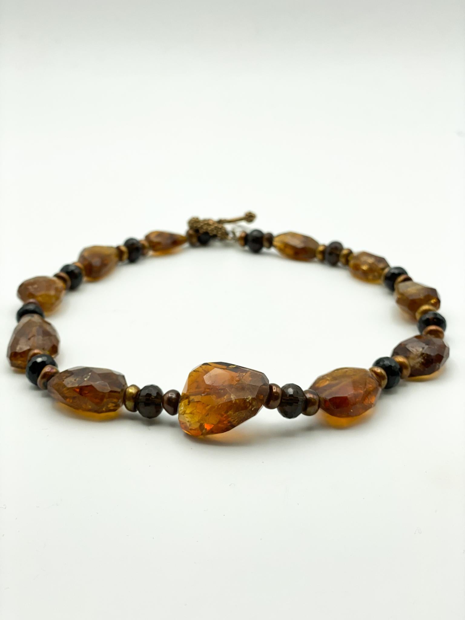 Citrine, Smokey Quartz, Bronze Pearls, 18K Gold Clasp
Beaded, Stone, Necklace
Approximately 18 inches in length/around. 