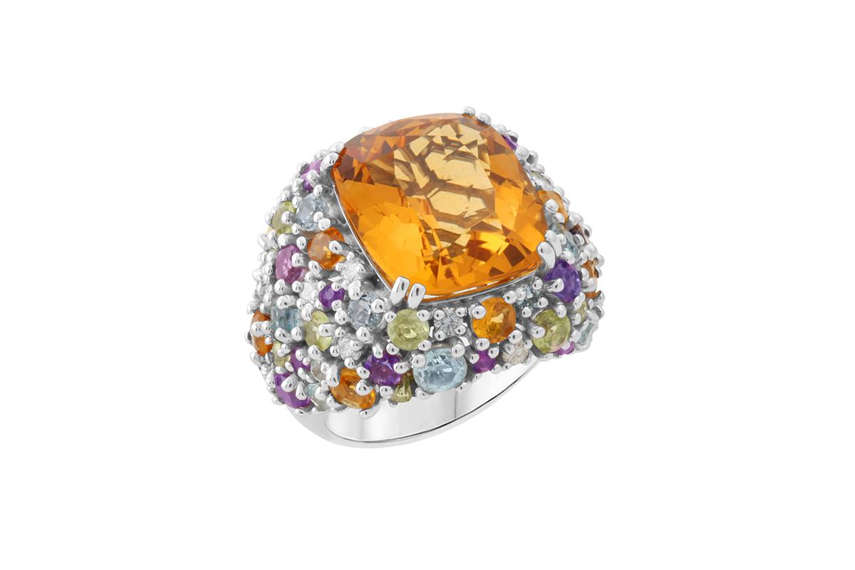 A ring that radiates the light of the sun. 
A unique and only one available piece 
18K white gold 
Citrine: 
– Weight (total): 12.12 carats 
– Cut: cushion cut 
Amethyst: 
– Weight (total): 1.30 carats 
– Cut: Round brilliant 
Aquamarine : 
– Weight