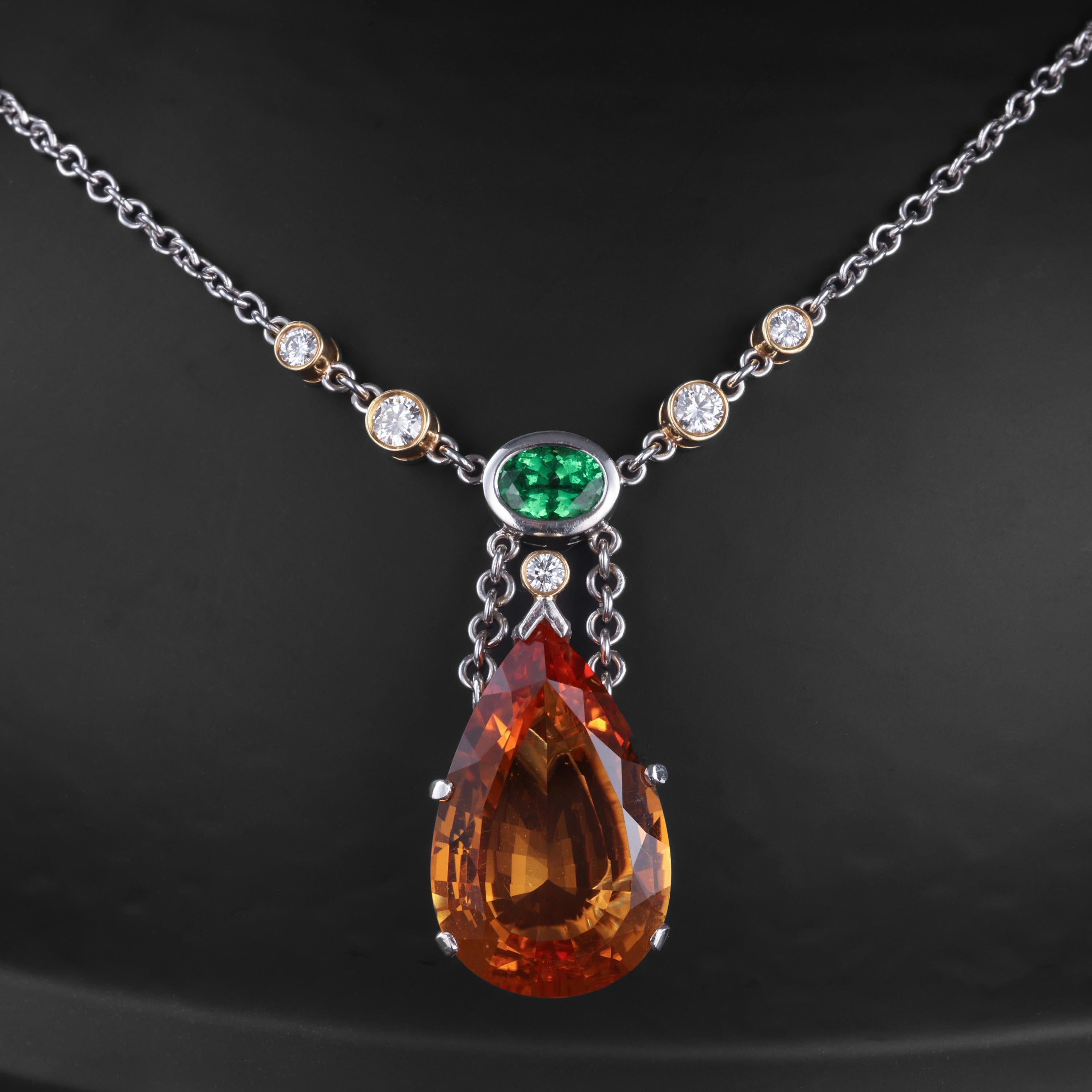A colorful and contemporary unisex citrine, tsavorite garnet, and diamond necklace hand-crafted in sturdy, gleaming platinum. Perfect for everyday wear, it's both casual and elegant for a man or a woman.

A nearly 12-carat amber-yellow pear-shaped