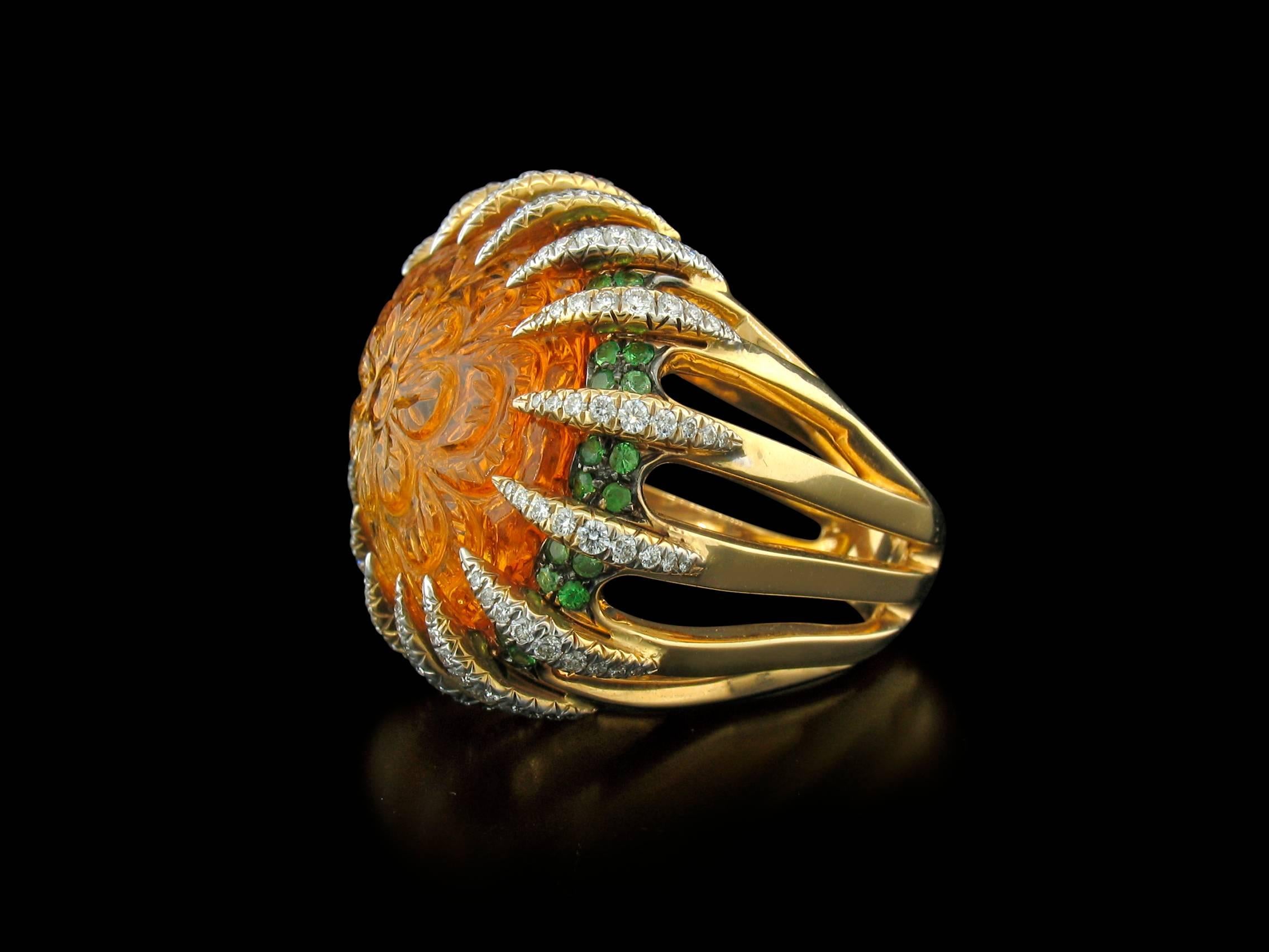 Tony Duquette Citrine Ring in 18K features a magnificent carved Citrine weighing a total of 39.60 carats, Tsavorite Garnet pave weighing a total of 1.26 carats, and Diamond pave 'prong' accents weigh 1.24 carats.  Size 7 1/2~8.
**This ring may be