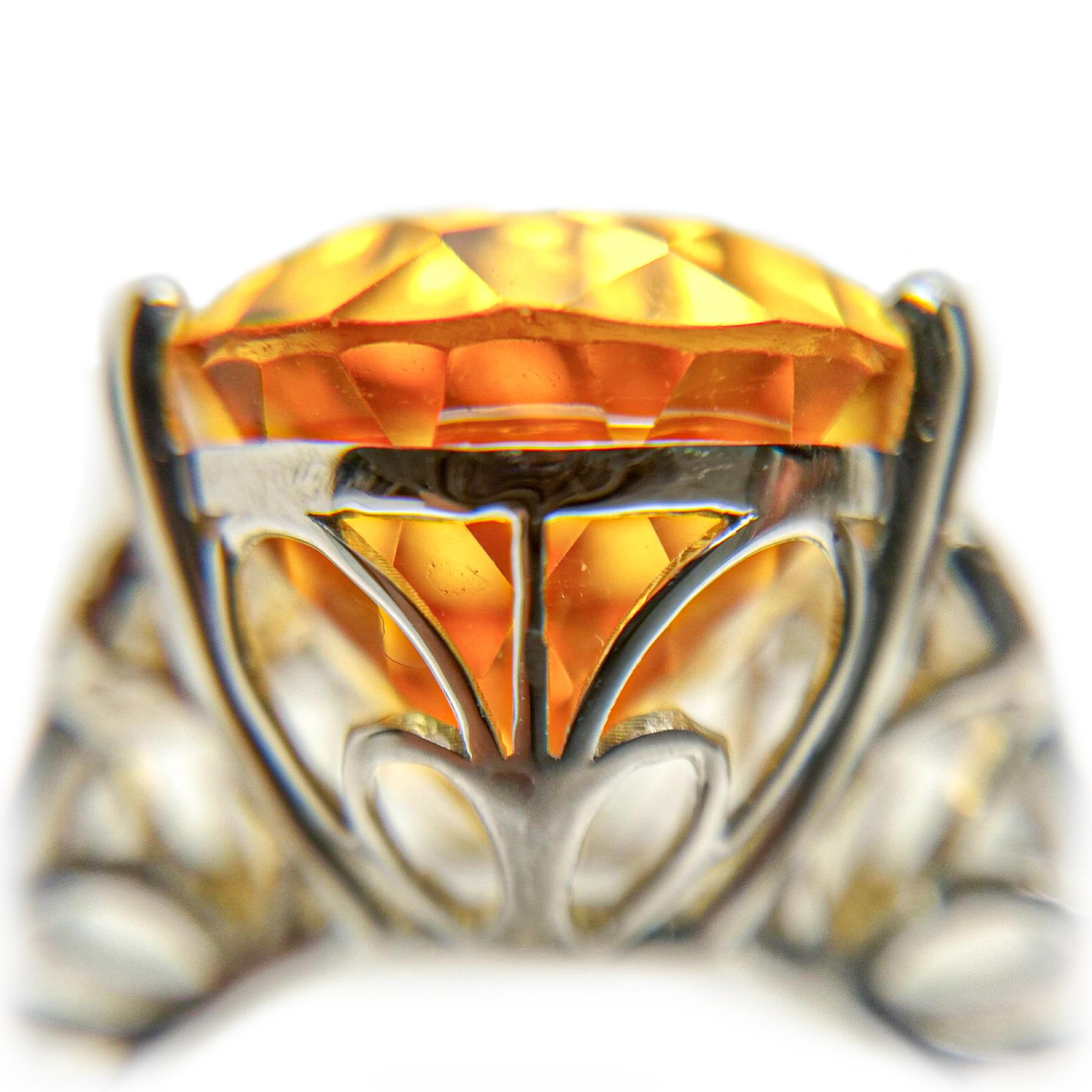 Pear shape citrine and diamond cocktail ring. Handcrafted, contemporary, golden honey yellow, transparency and  high luster 13.91 carats pear shape citrine set in high profile, encased in basket mounting with four bead prongs and one split prong.
