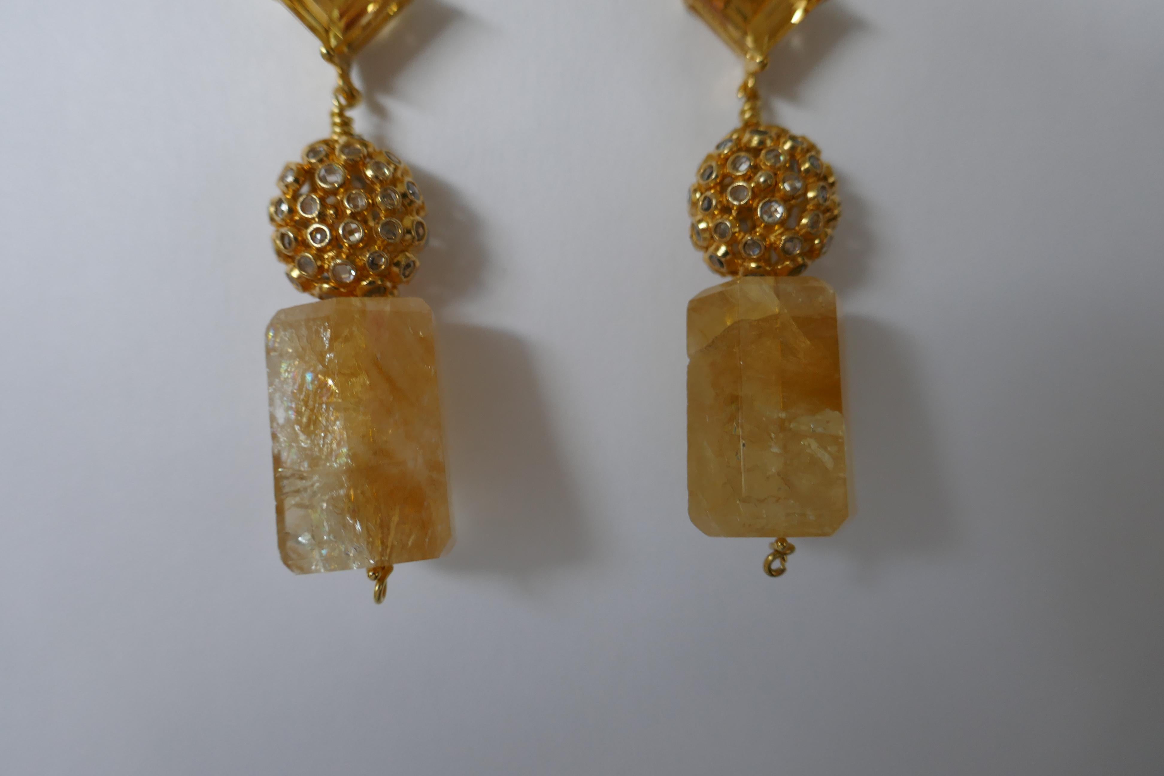These citrine earrings are stunning. The earrings post are 10mm x 10mm citrine on 14k plated sterling silver, oval sphere is 14k plated sterling silver and white topaz, the citrine bead at the bottom is approximately 13mm x 19mm. The large back are