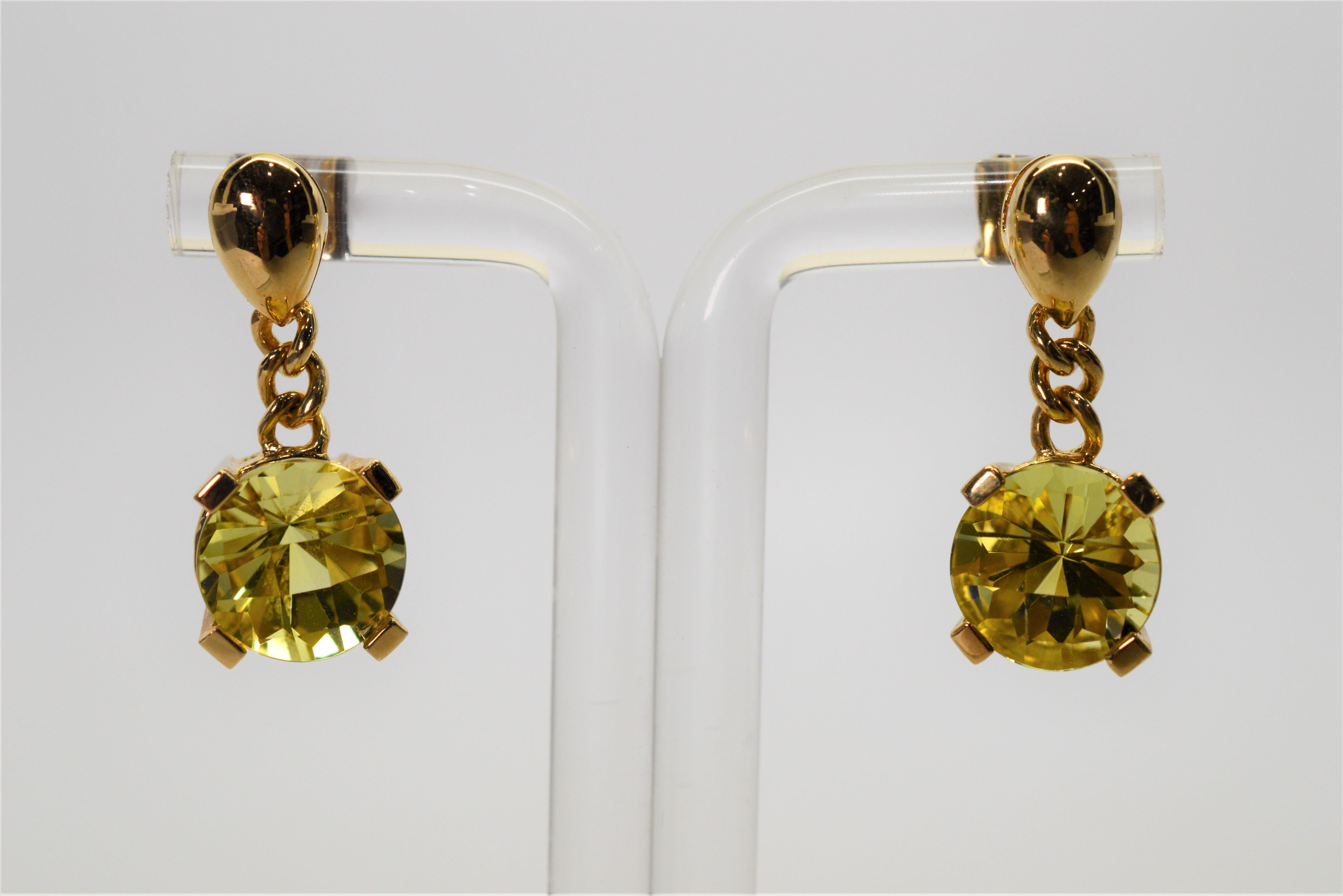 The natural citrine stones, complimented by rich fourteen carat yellow gold, make these earrings bright and energetic. For pieced ears with post backs, the drop is approximately 3/4 inch. Two 10 mm round citrine quartz stones, each more than three