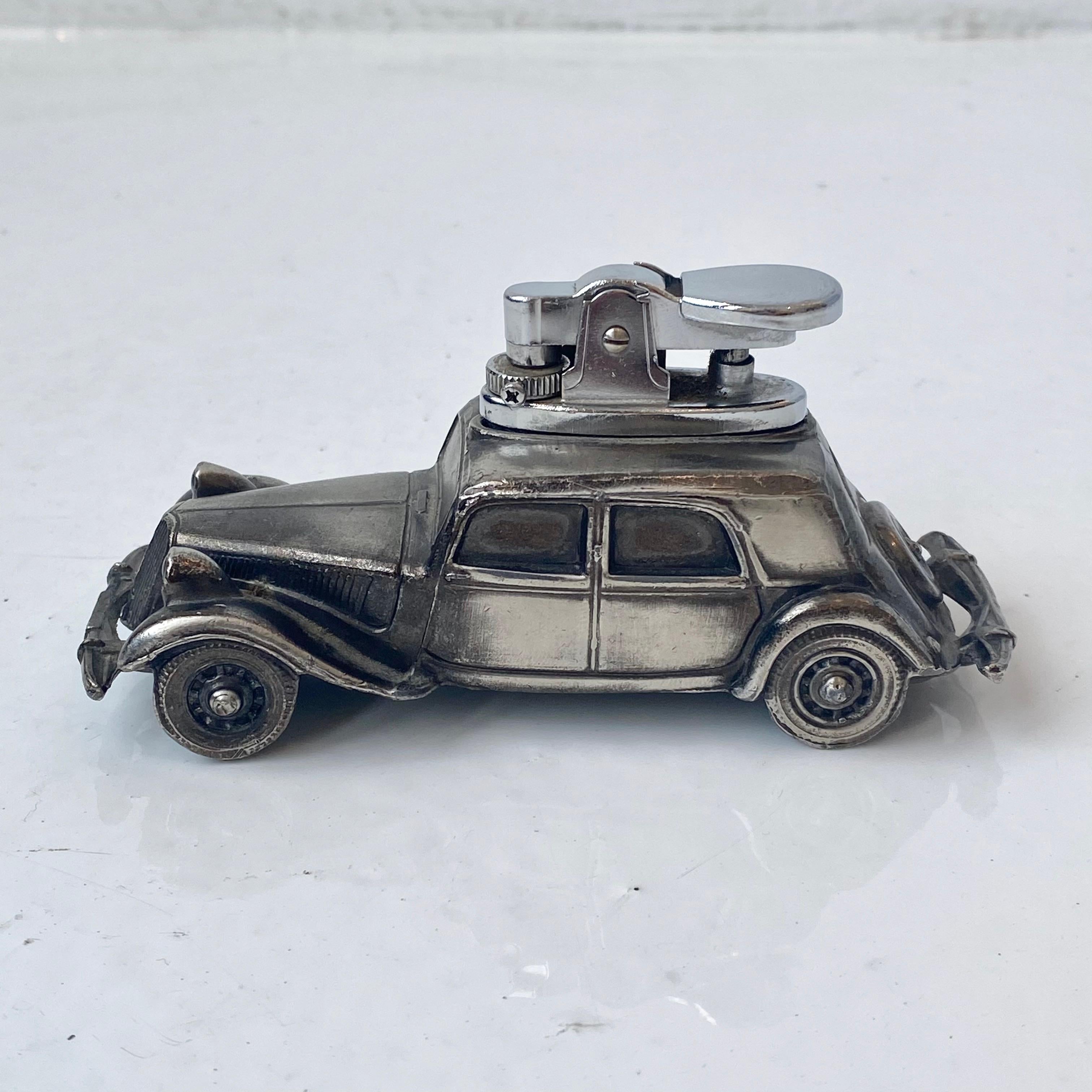 Unique vintage table lighter in the shape of a vintage Citroen car. Made of metal with 