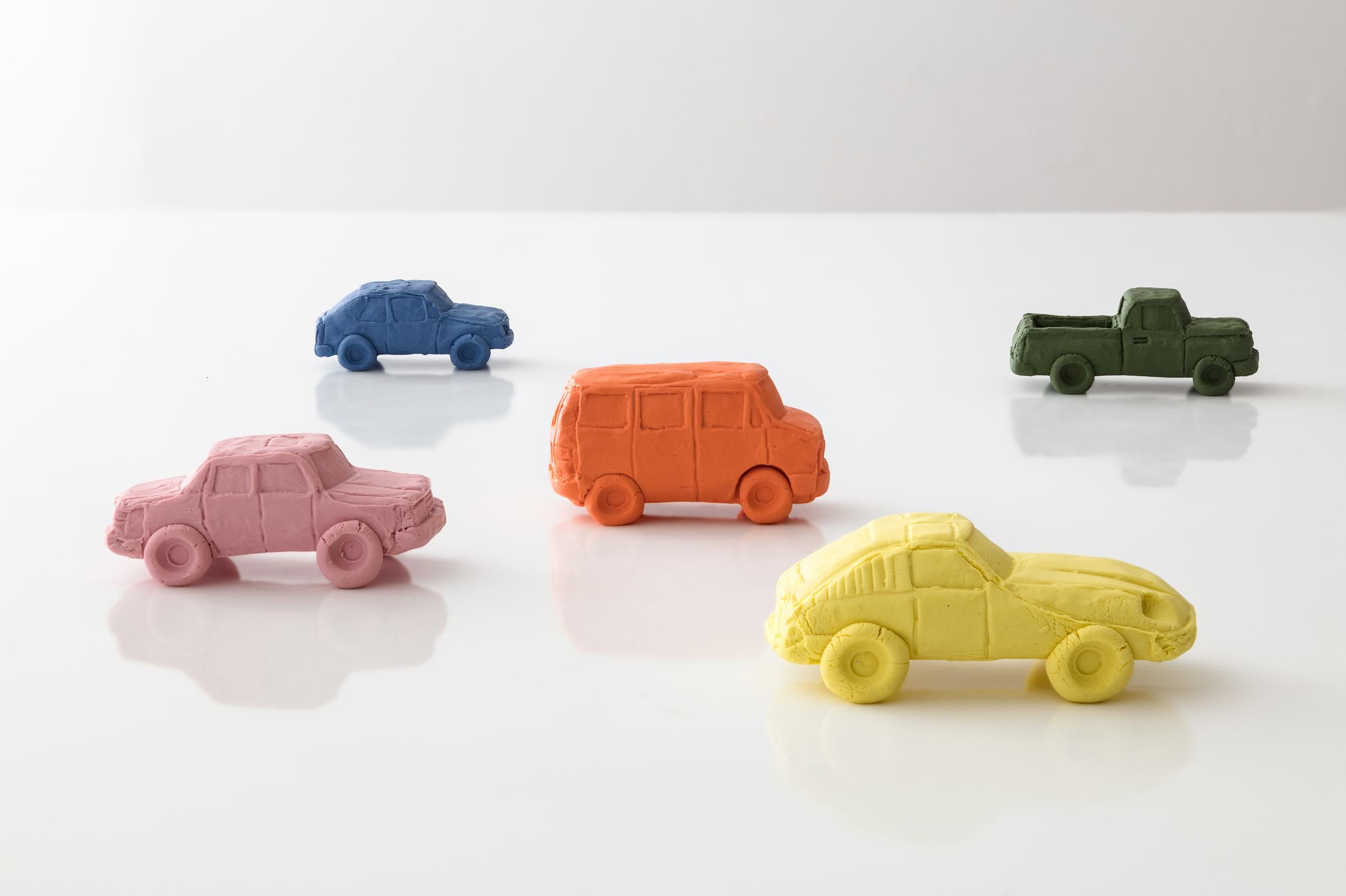 Keith Simpson's miniature porcelain Ceramic Cars sculptures reflect memories of vehicles from his childhood and the 1980's. With Fort Makers, he chose colors and silhouettes of cars that are charming and magnetic, yet also somewhat humble. Keith