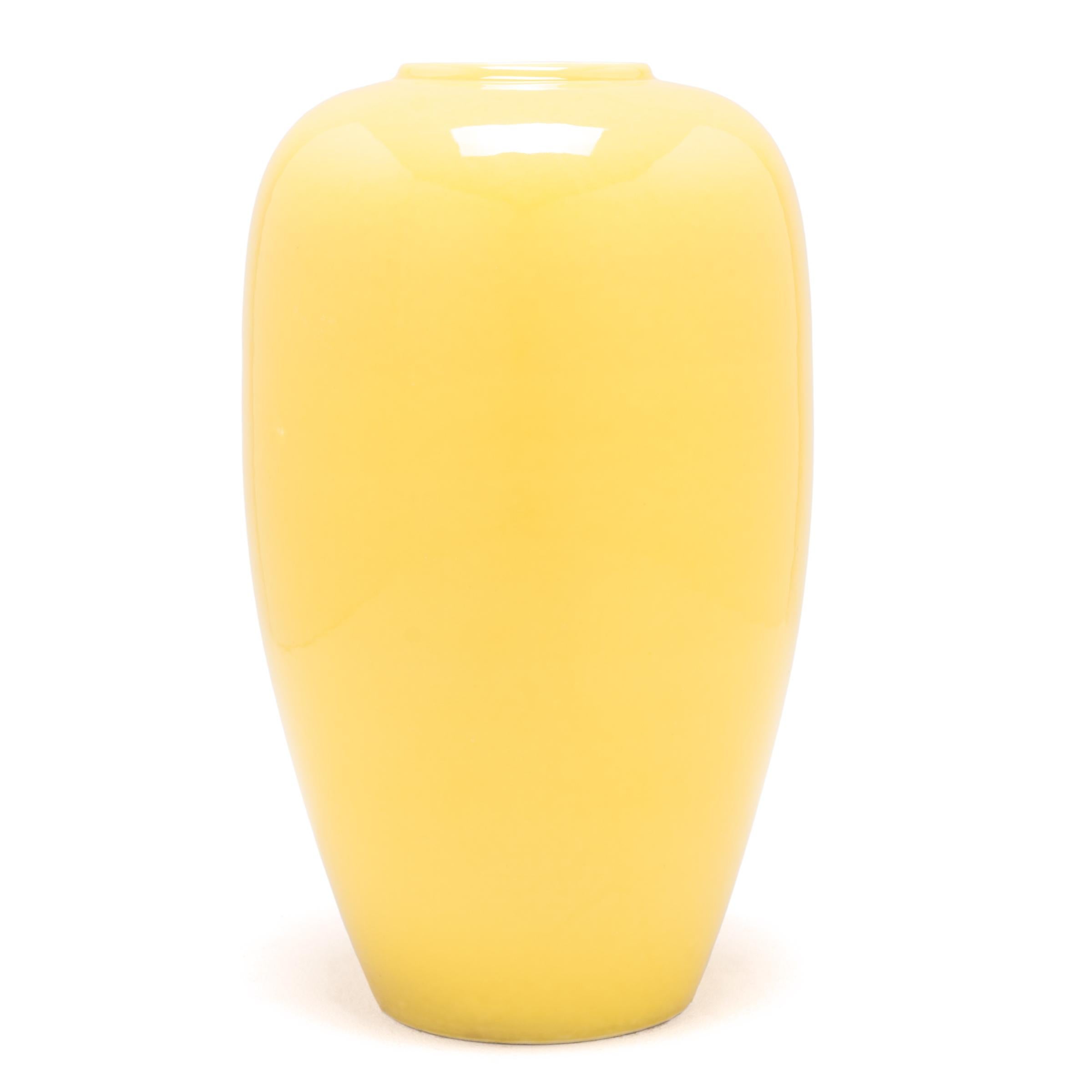 Sunny citron glaze coats the subtle taper of this Classic vase in brilliant color. Formed in a traditional porcelain shape, the contemporary vase celebrates the revered history of Chinese monochrome ceramics with vibrant citron yellow, a perfect way