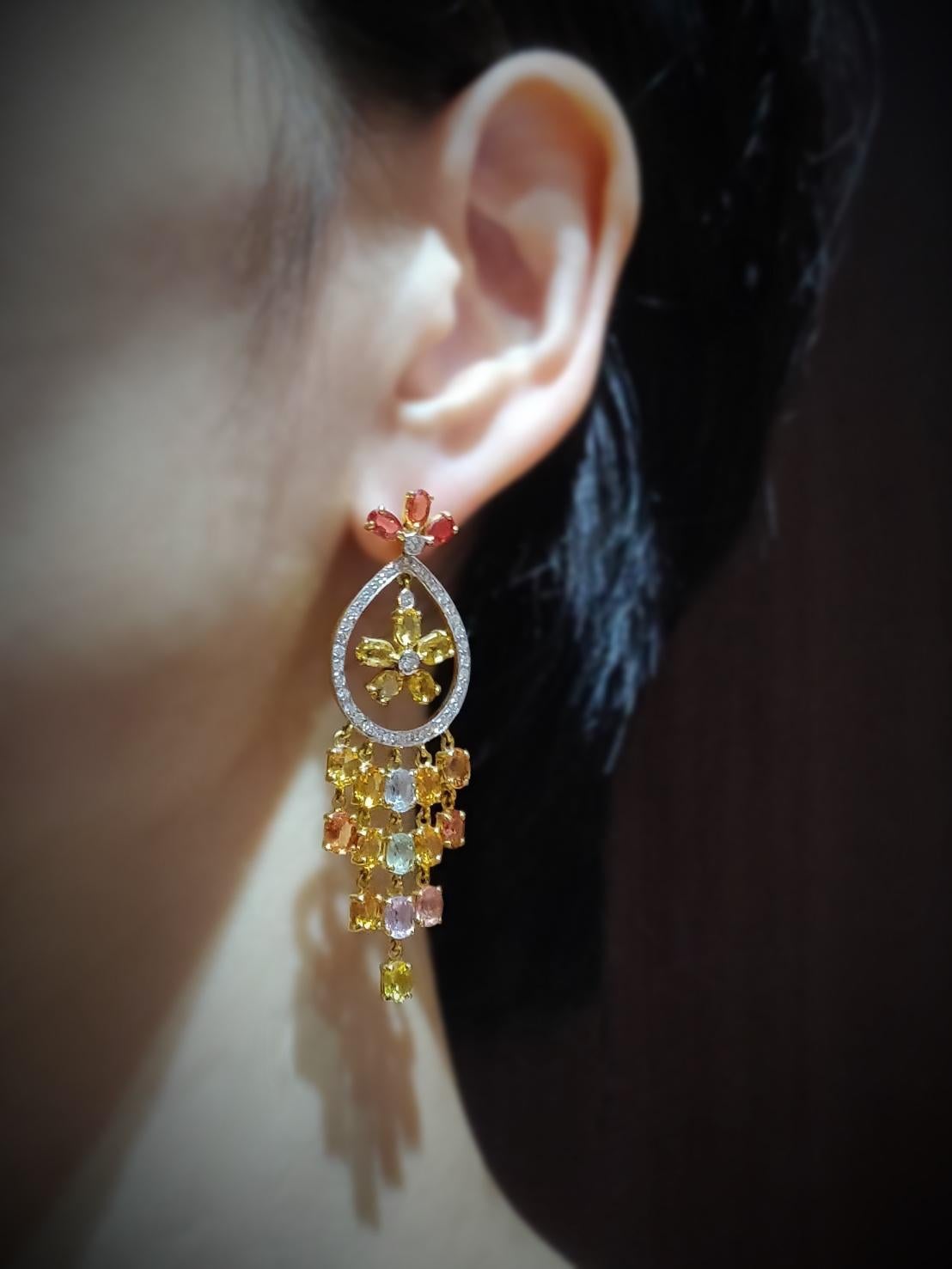 Summery earrings that will remind you of a holiday in Sicily, the cool sea breeze that wafts through the window and the scent of lemons and oranges from the citrus grove.

Gold: 18K Yellow Gold, 17.75 g
Diamond: 1.21 ct
Stones: Yellow Sapphire,