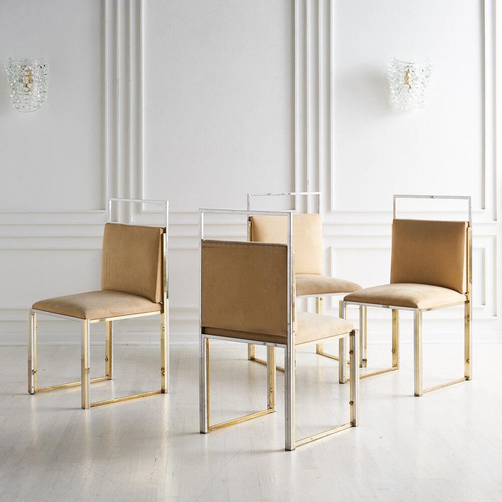 A set of 4 brass and chrome dining chairs by Cittone Oggi. Clean, modern lines make these an easy and gorgeous fit.

