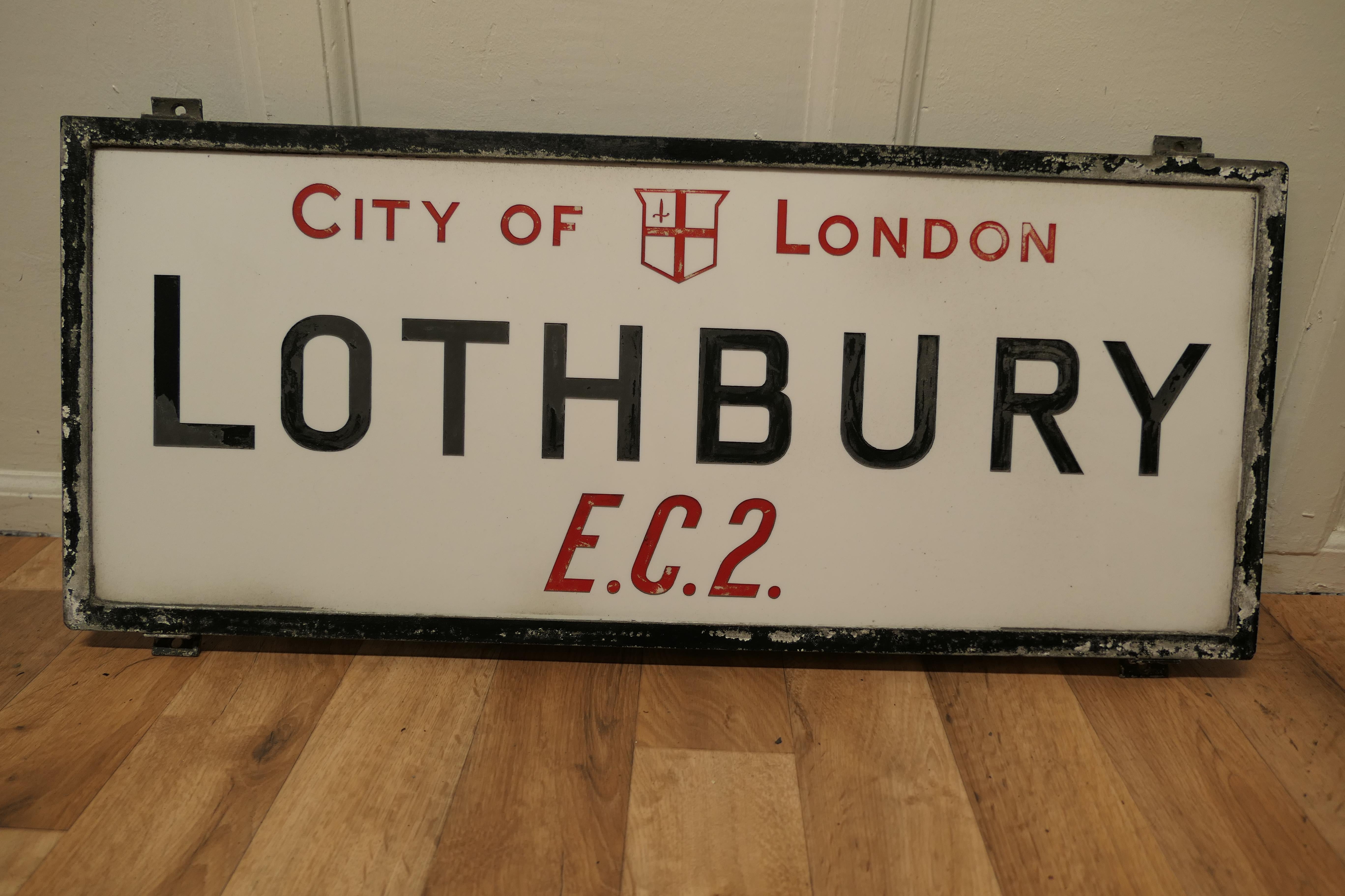 City of London glass Edwardian Street Sign, Lothbury E.C.2

This is a City of London Street sign, it is set in its Cast Iron Frame, it is made in etched Vitrolite Glass, the City Of London and E.C.3 are impressed in red and the other characters