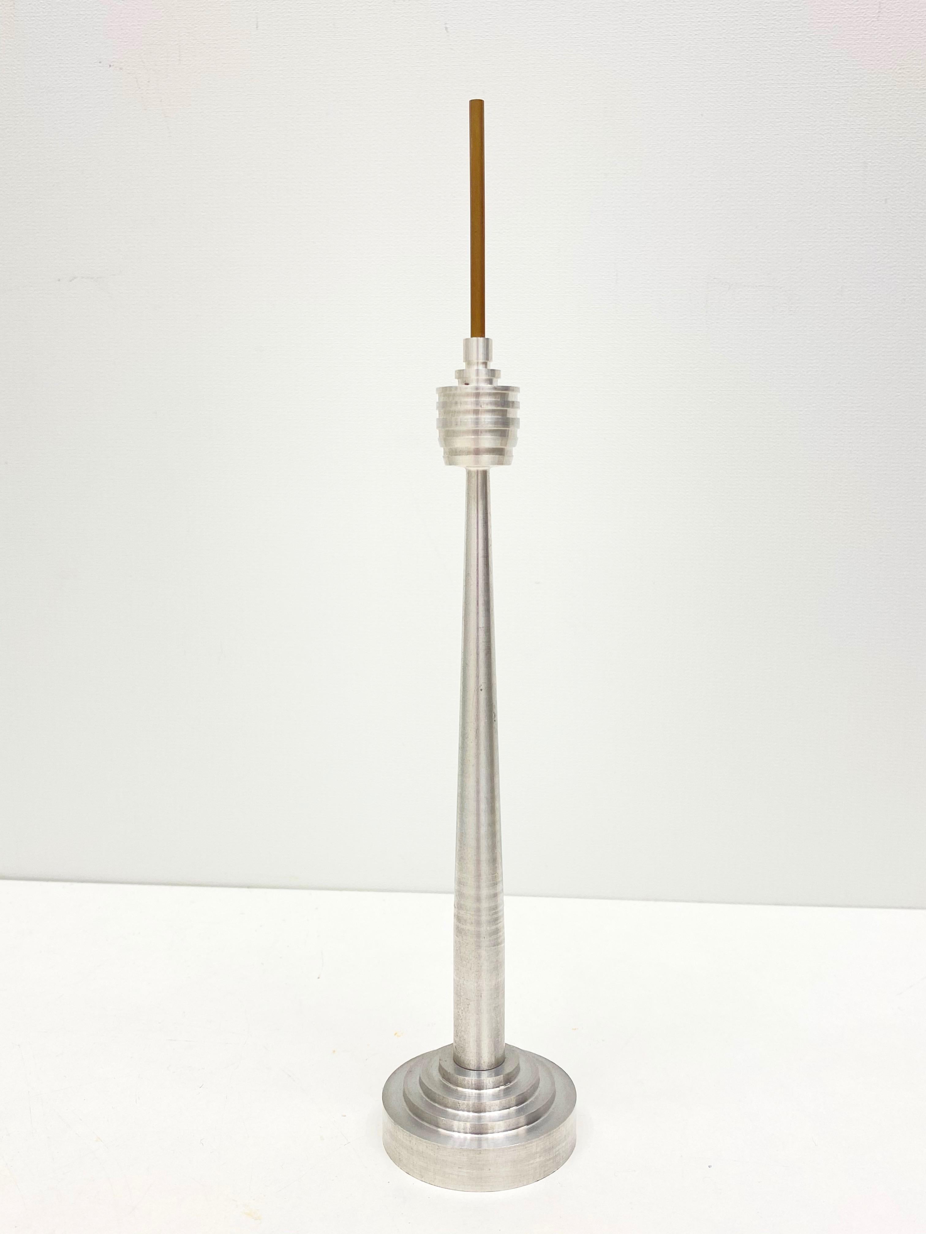 Scaled model of the Stuttgart television tower. Hand-spun in Aluminum, with brass top. A nice architectural sculpture for every living or men’s room. It has a beautiful patina due to the age.