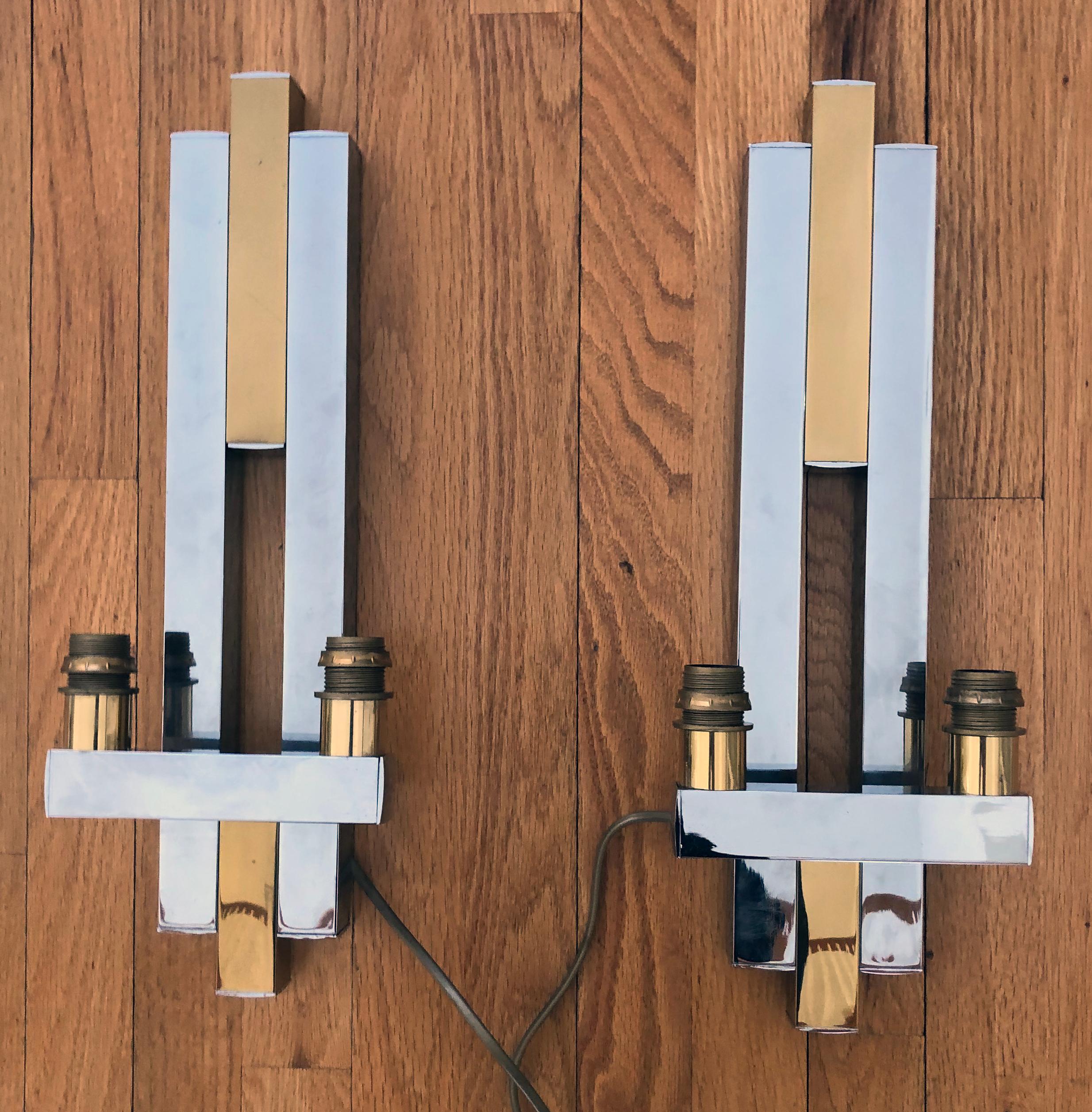 Pair of City Scape 2 light wall sconces possibly Paul Evans.
Polished nickel and brass.
Measures: Height 18.5