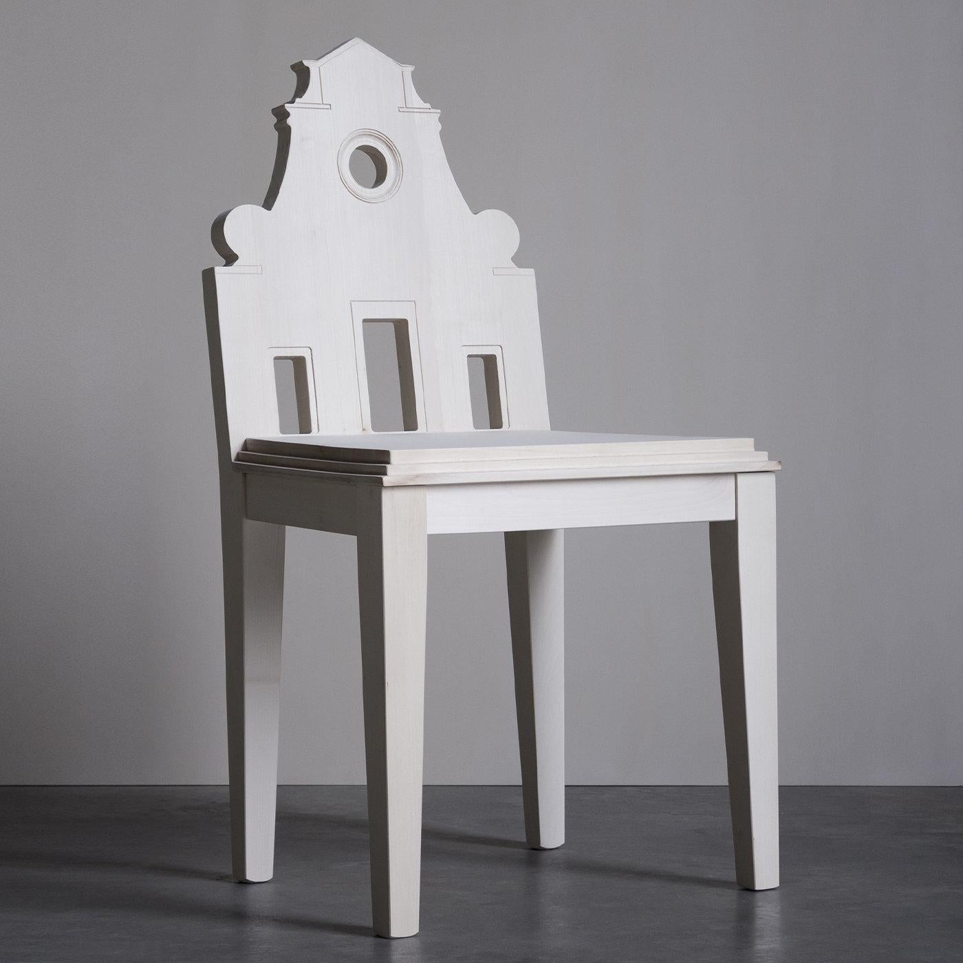 The simple yet ethereal lines of the Santo Spirito Church in Florence are superbly honored in this magnificent design by Cosimo De Vita: a solid wood chair distinguished by a hand-carved backrest depicting a realistic representation of this timeless