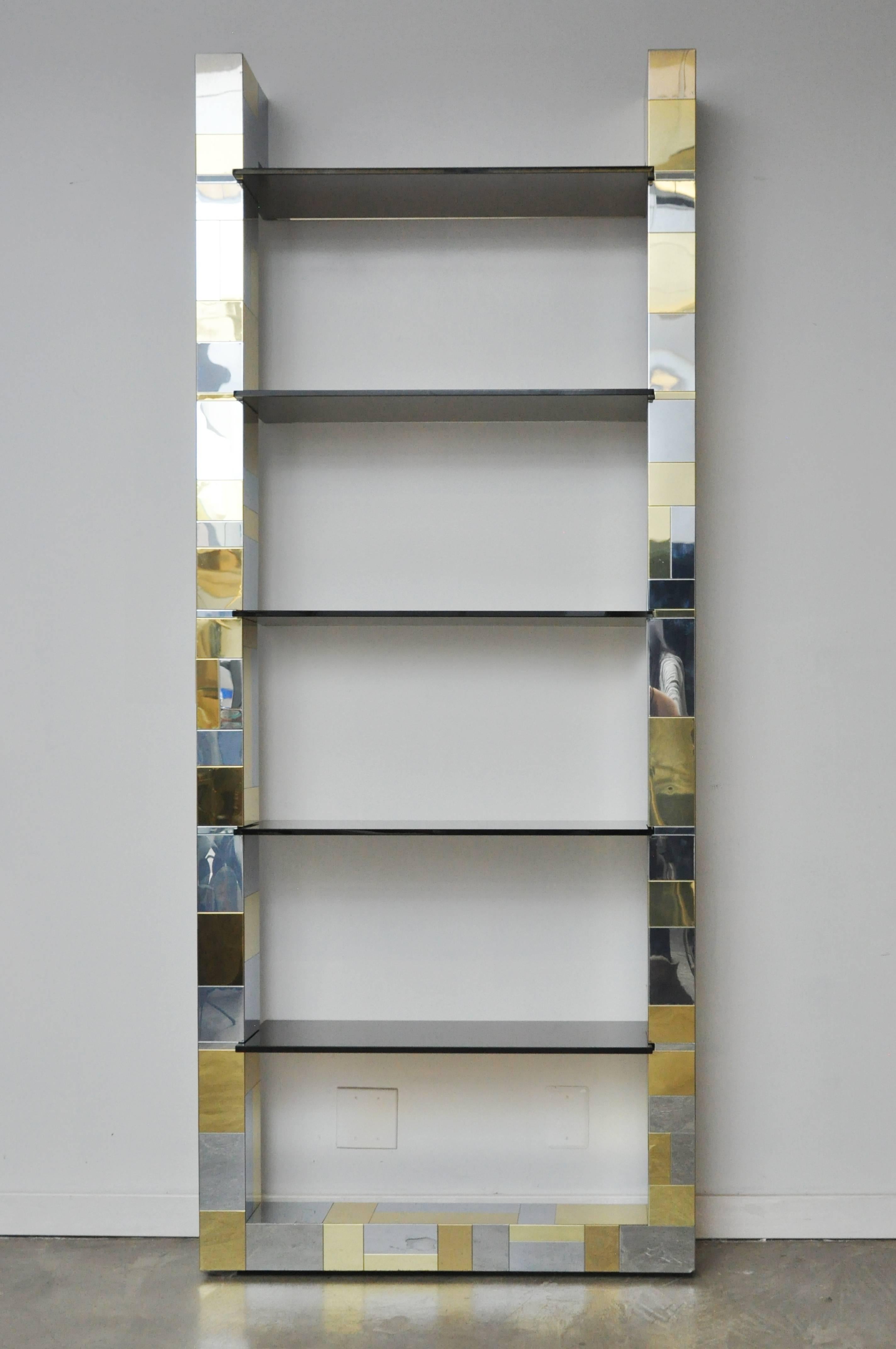 Brass and chrome etagere wall unit by Paul Evans for Directional. Smoked glass display shelves. Excellent condition.