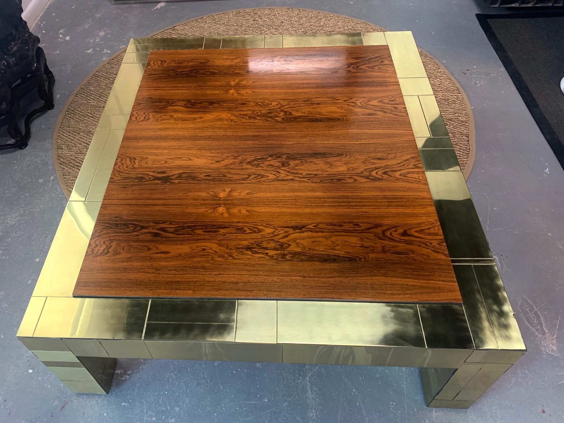 A large brass patchwork cityscape coffee table in contrast with a rather unusual Brazilian rosewood top. A very generous size with striking visual impact. This is a custom pieces executed circa 1975 by Paul Evans for Directional.