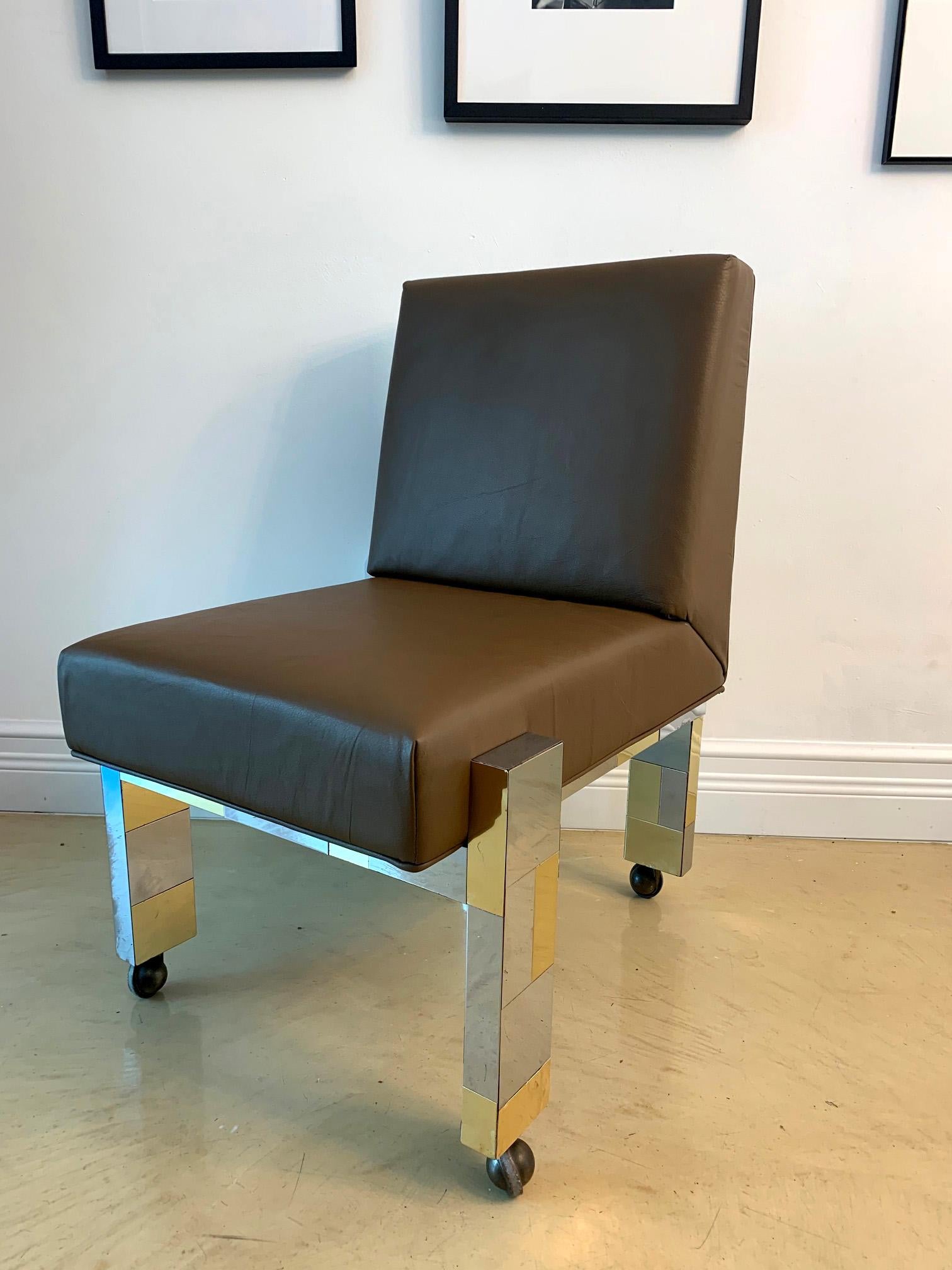 A wonderful cityscape chair in chrome and brass patchwork made by Paul Evans studio for Directional, circa 1974. The chair is supported by exposed legs that extend to the back, giving an interesting profile from the all sides, especially with the
