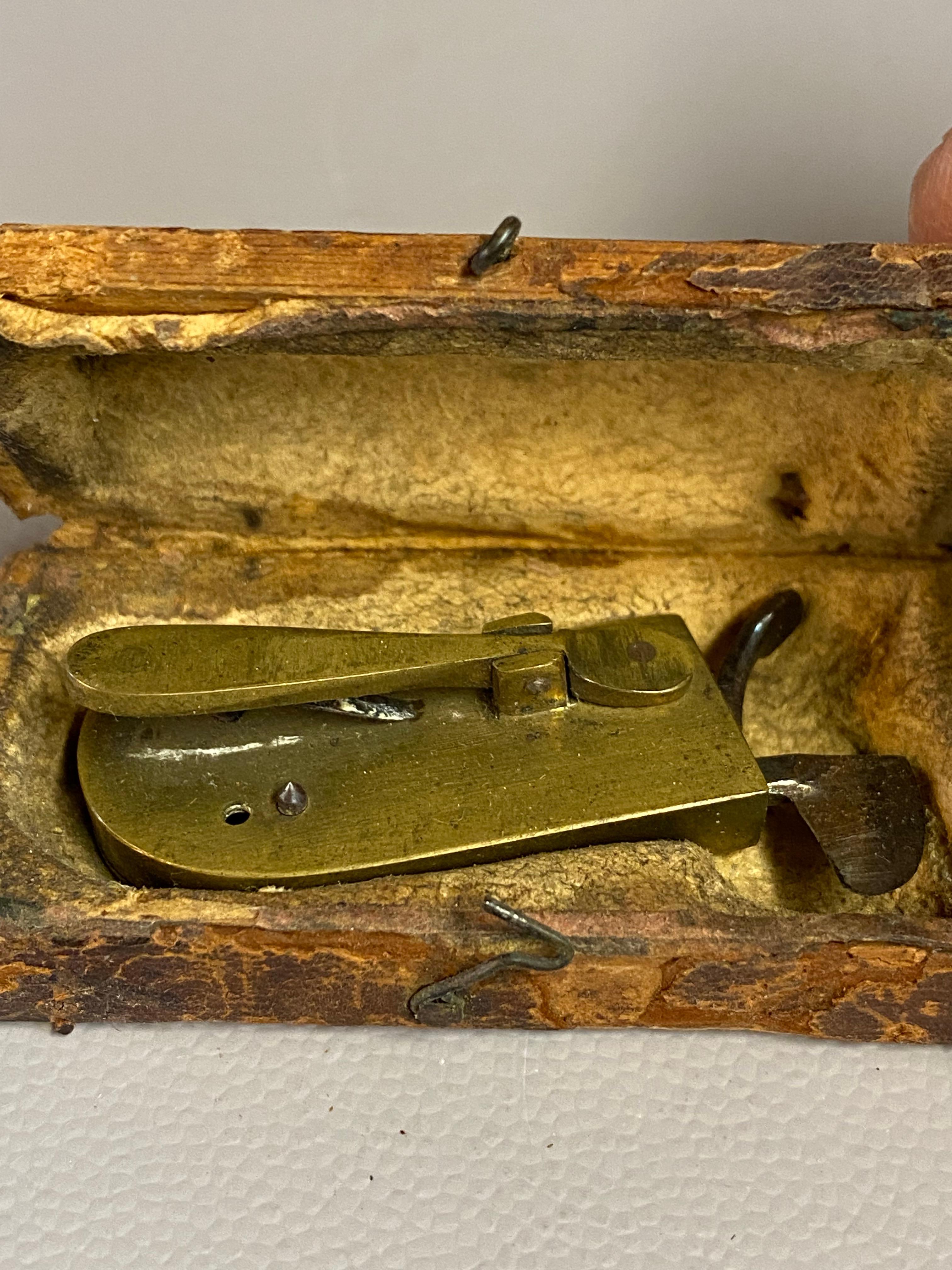 American Civil War Era brass bodied bloodletting fleam, phlebetome or scarificator. The fleam, which has many other spellings such as phleam, flew or fleame, is a very distinct surgical gadget that is a handheld venipuncture device when bloodletting