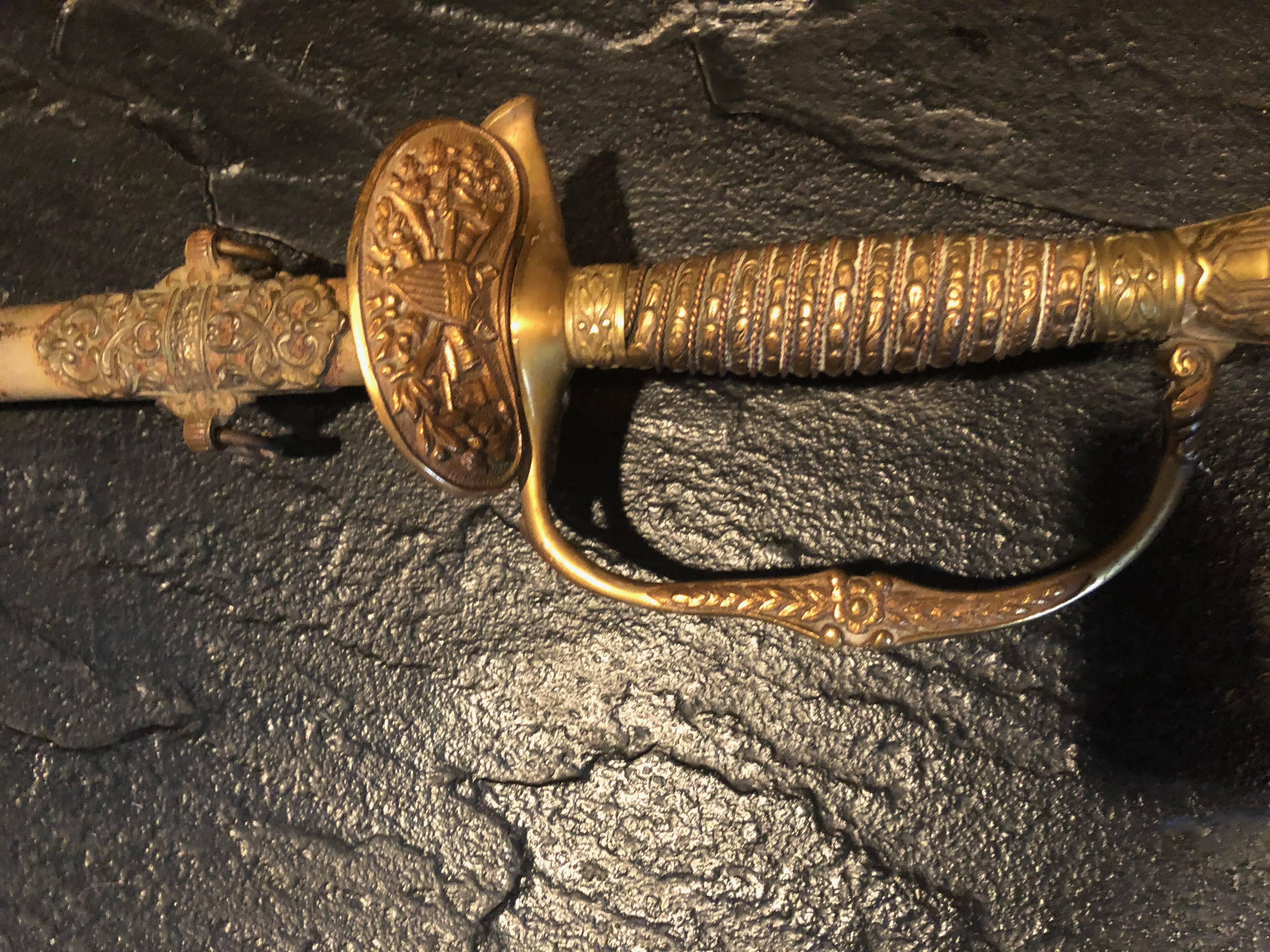 Nice Civil War era Union model 1860 field and staff officer's sword. Sword has deluxe pattern with solid brass wire wrapped handle. Blade is etched with draped flag motif.