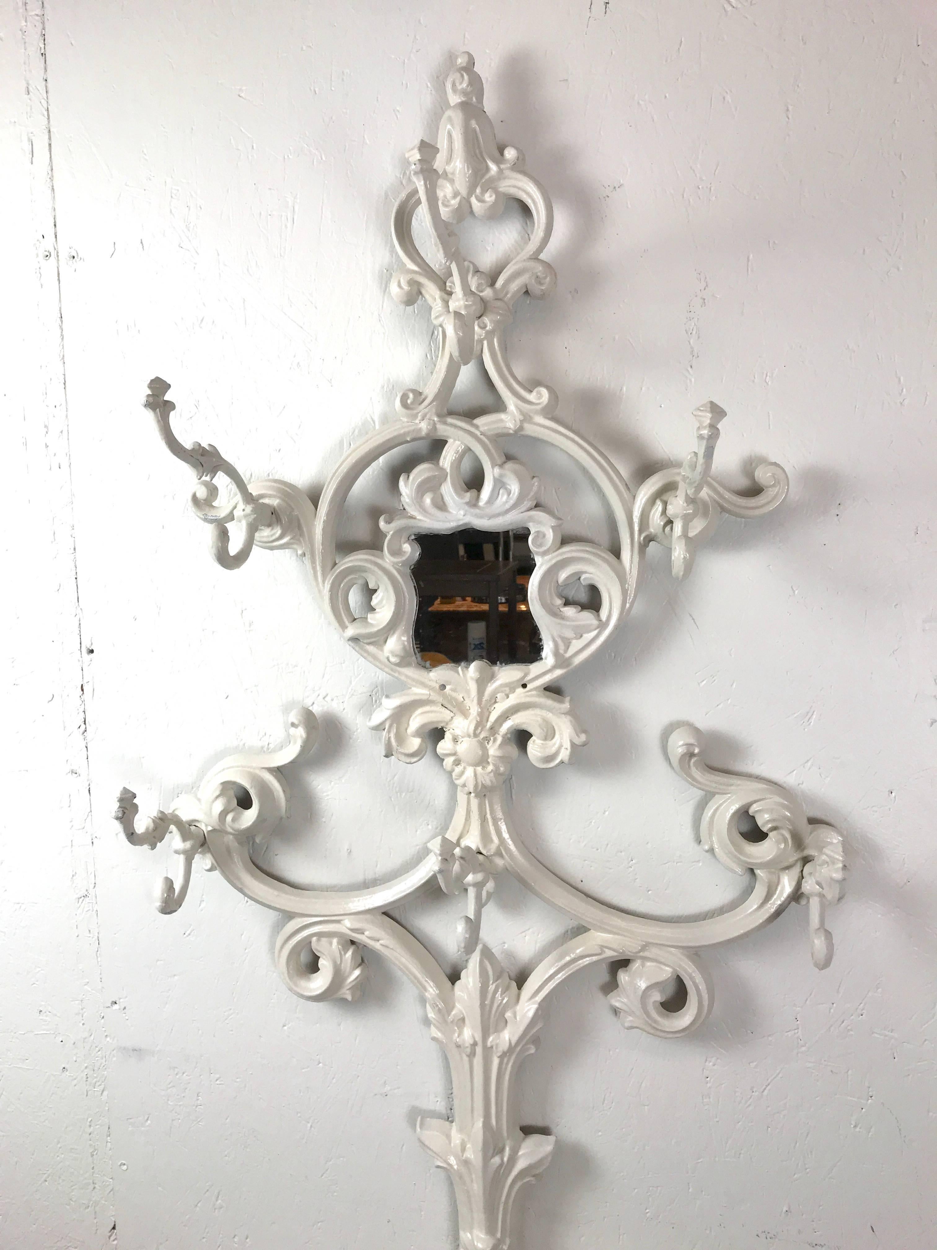 Civil War period cast iron hall tree, in Rococo fitted with hooks and umbrella stand.