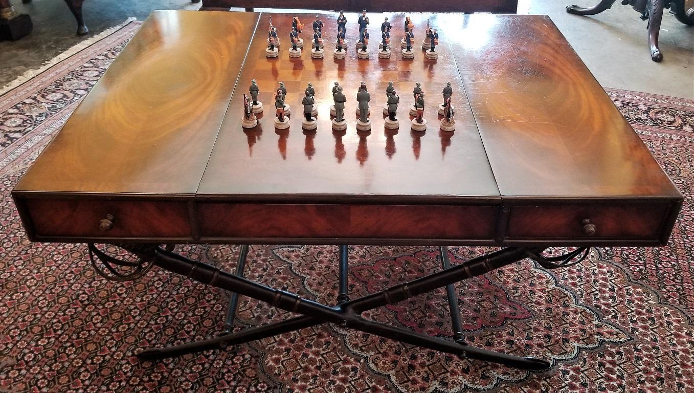 Presenting a unique and custom made Civil War themed mahogany games table with sword legs.

This games table was probably made in the early 20th century and in our opinion was a custom made or commissioned piece as we can find no other like