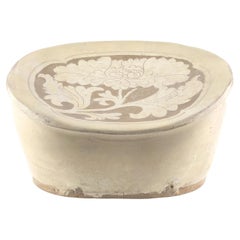 Cizhou carved bean-shaped pillow, Song-Jin Dynasty, 11th-12th century