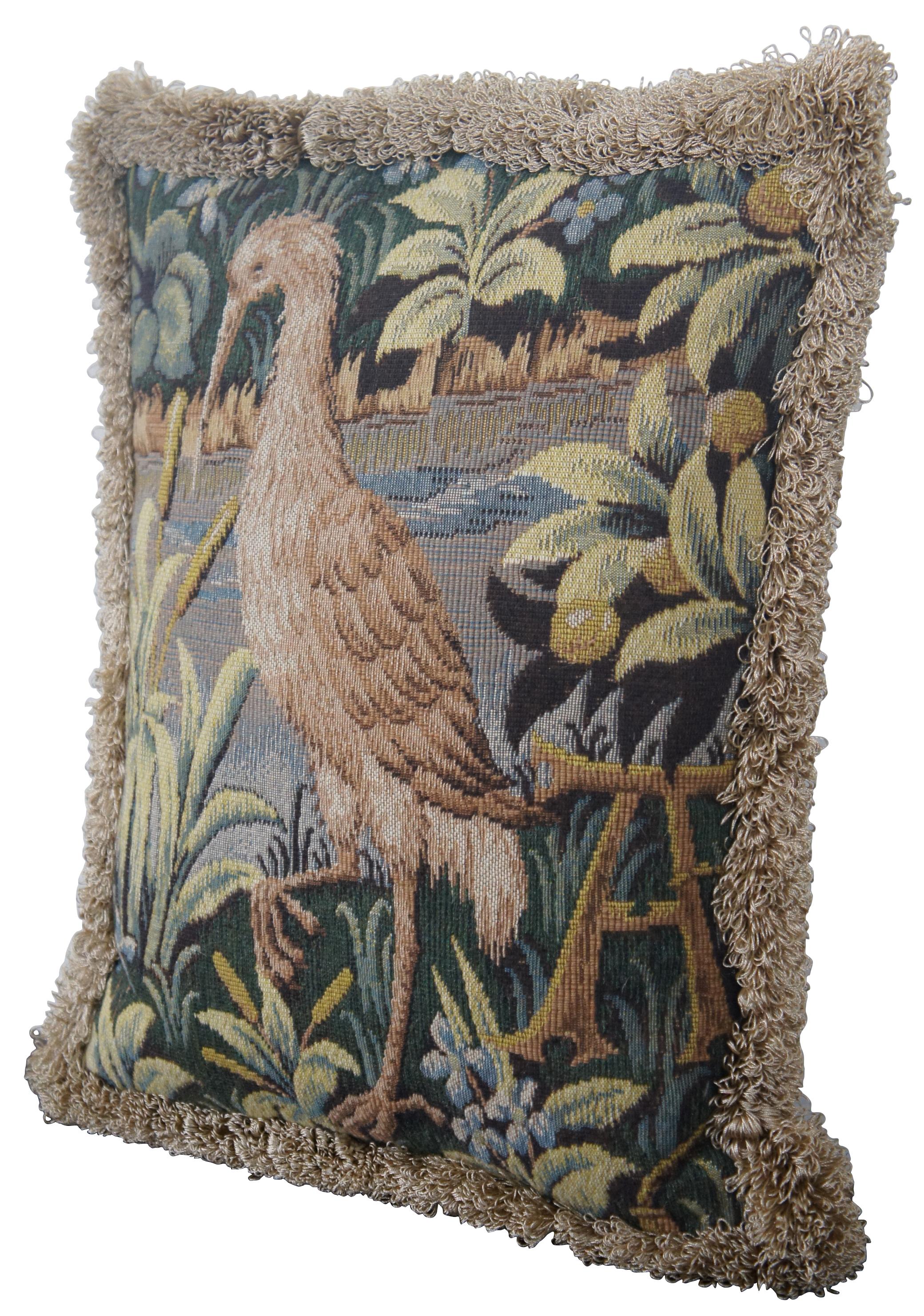 Medieval style, down filled, embroidered throw pillow with velour back and gold fringe, featuring a heron or crane at the edge of a lake with the capital letter A, made in France for CJC of St Simons Island, GA.
  