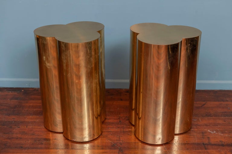 C. Jere design brass clover leaf brass pedestals or end tables. Playful shape stand perfect for sculptures or lamps flanking a credenza or entry way. Signed in original condition showing scuffs, scratches and light oxidation but still present well