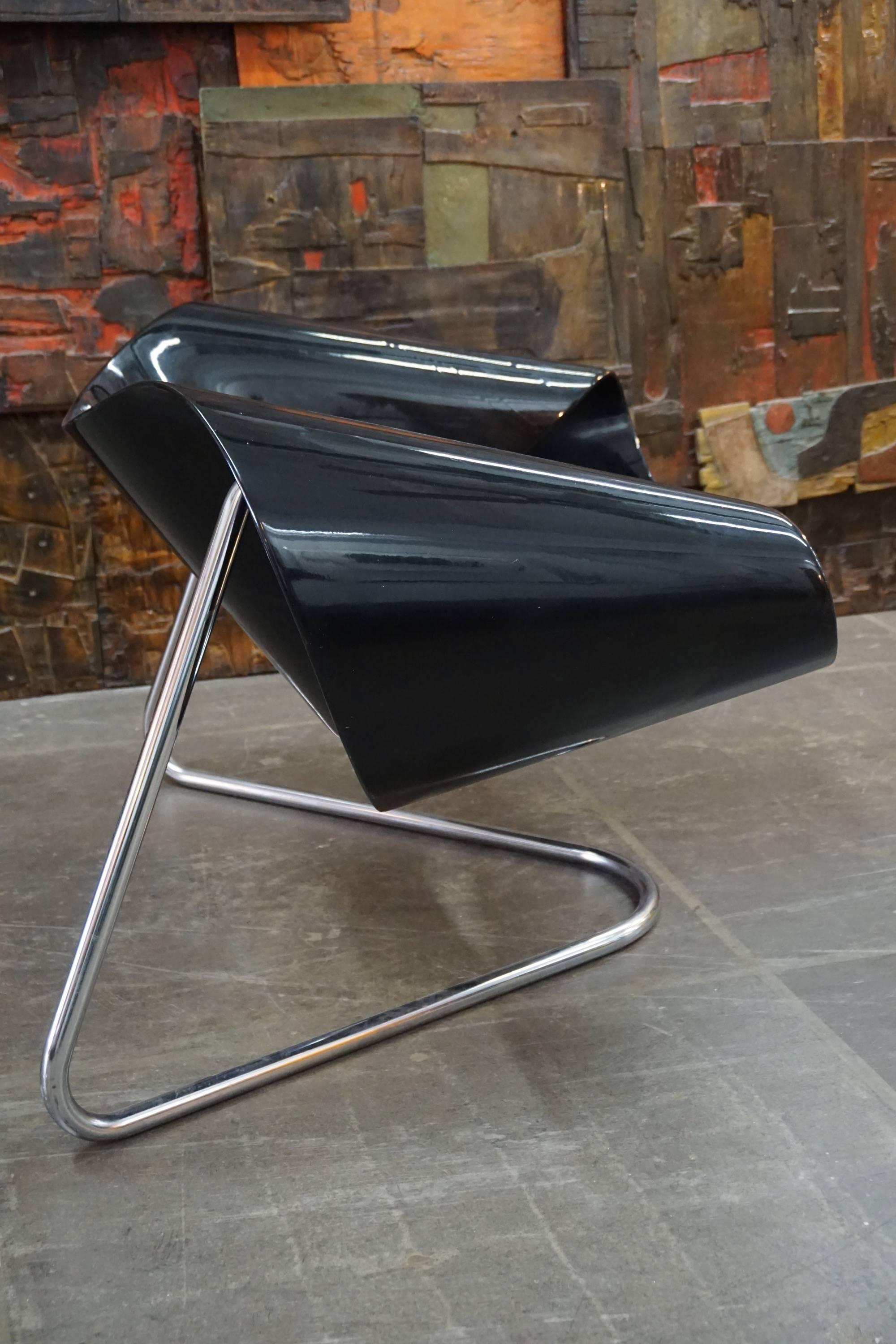 Designed by Franca Stagi and Cesare Leonardi for Bernini, Italy, 1961. Black lacquered fiberglass frame on chromed tubular steel frame.