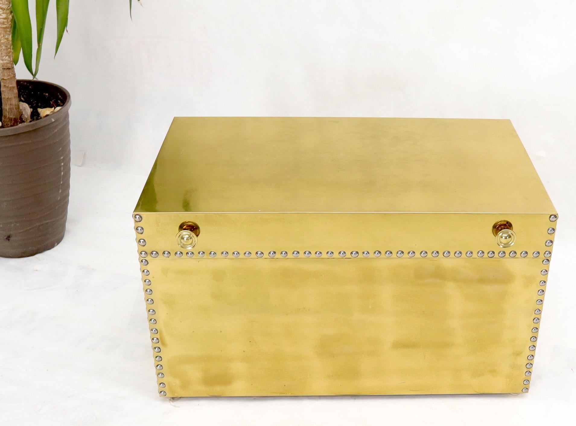 Mid-Century Modern brass-clad hope chest trunk large box with large folding carry handles.