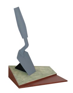 Escultura en forma de paleta clavada en el suelo (Modelo)