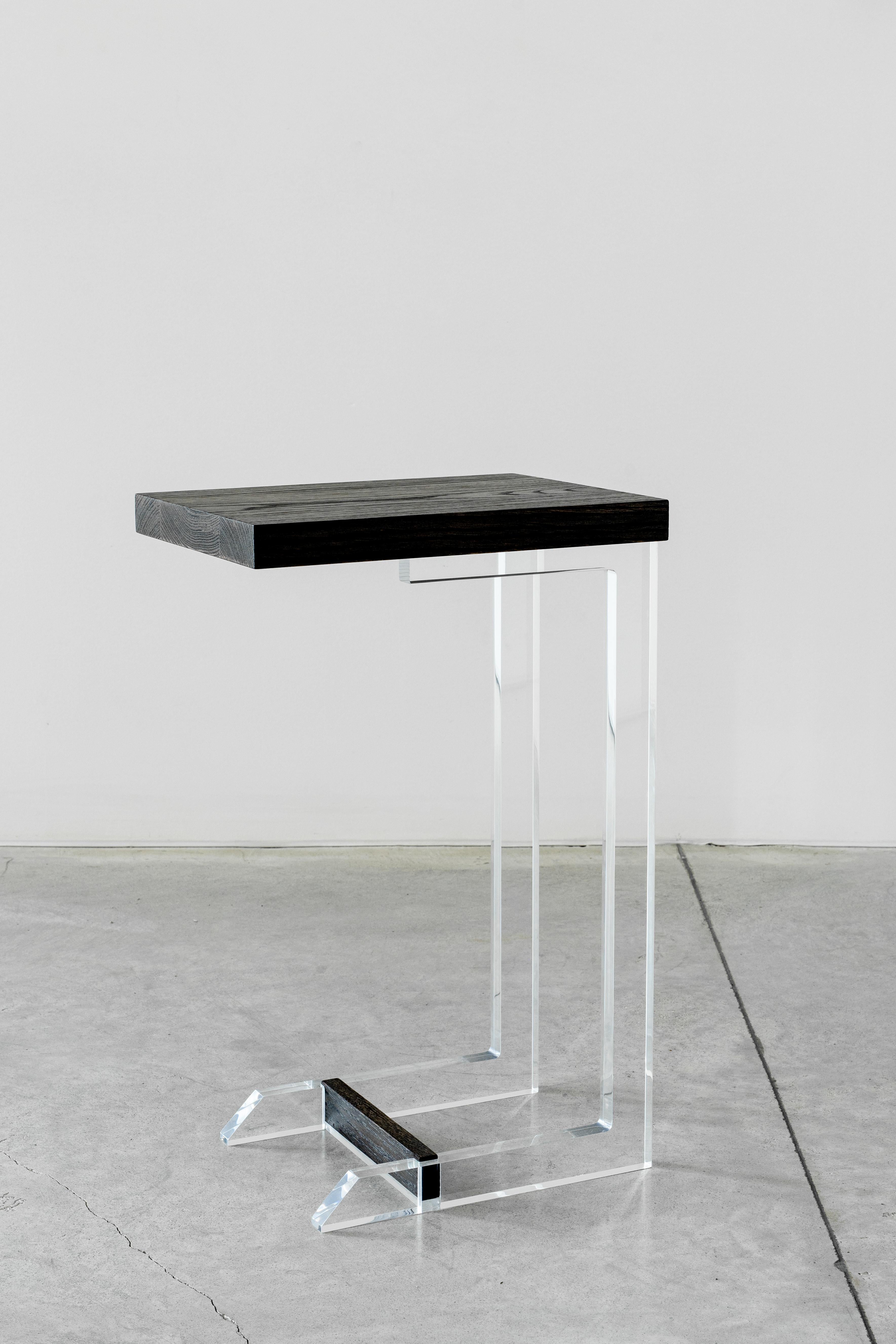 An end table that is always there when you need her, pulled up to a sofa for a cocktail or cup of tea, much like a best friend. The Clair End table was designed in a sleek silhouette of clear acrylic, adding a touch of brilliance, shown in a