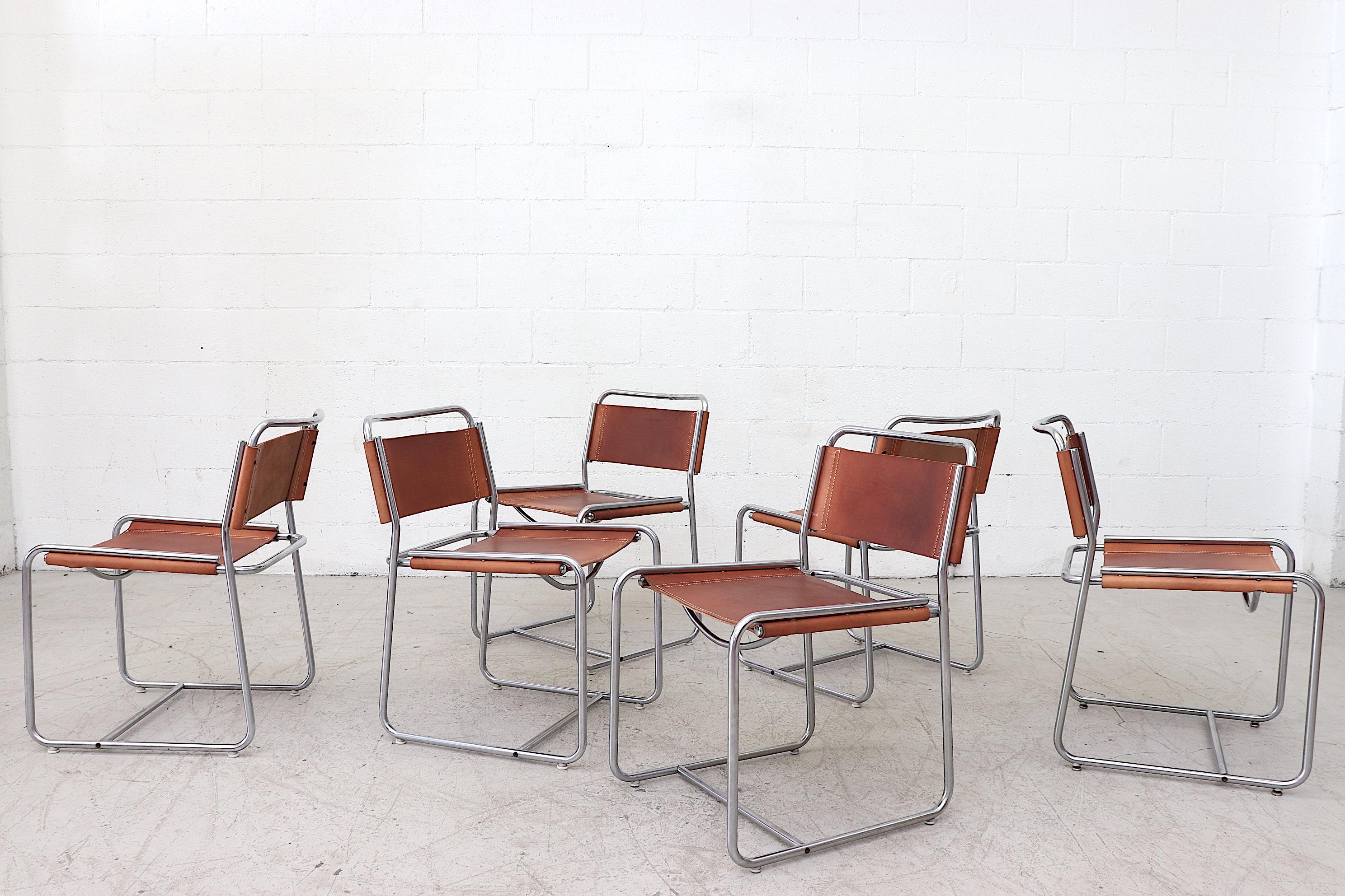 Rare set of 6 Claire Bataille and Paul Ibens Model SE18 leather dining chairs for 'T spectrum, Netherlands, 1971. Nickel-plated tubular steel frames with newly made period correct saddle leather seating including white cotton stitching. Simple but