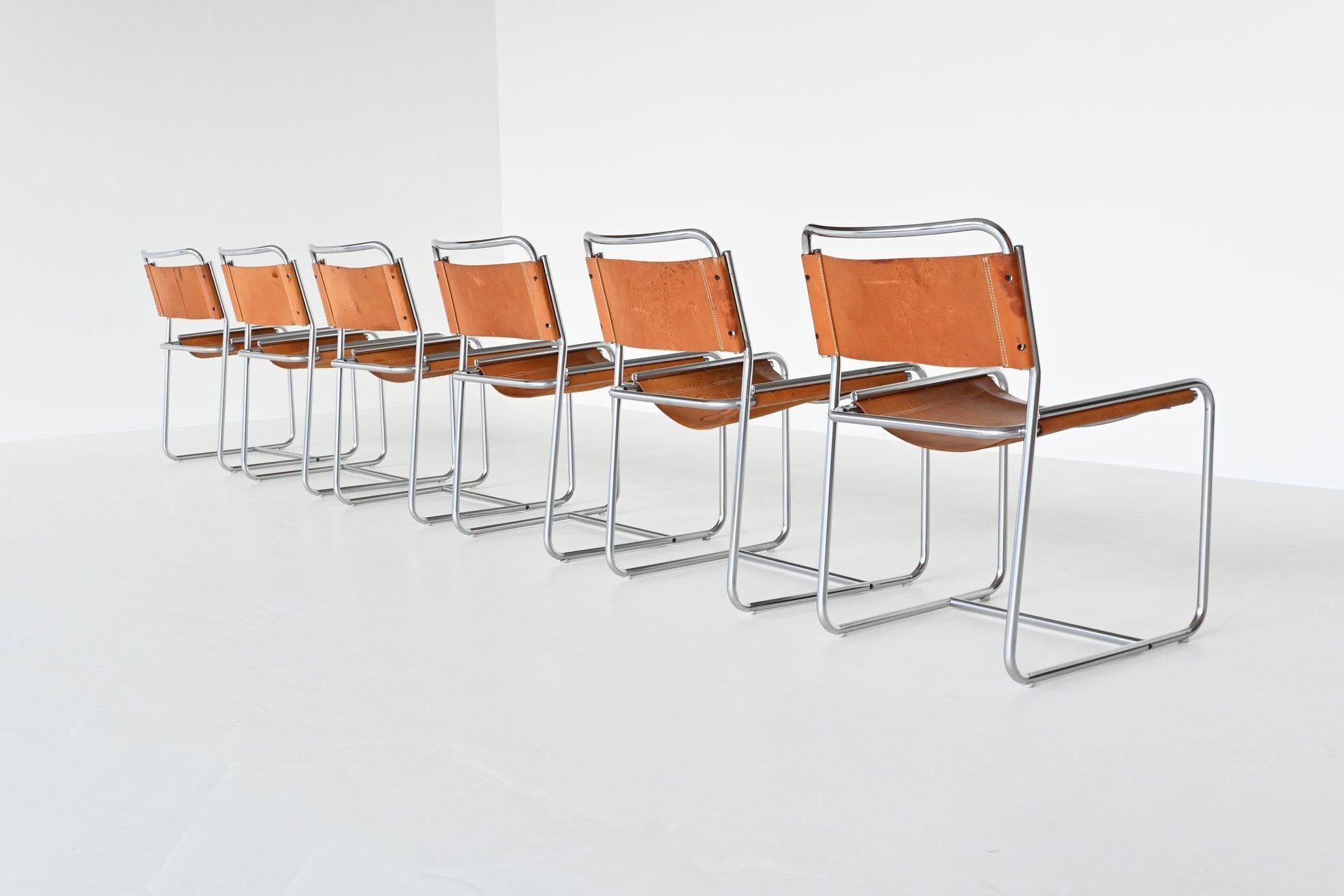 Beautiful set of six dining chairs model SE18 designed by Claire Bataille and Paul Ibens for ‘t Spectrum, the Netherlands 1971. These chairs have brushed steel tubular frames and natural saddle leather seats and backs. They have a very nice patina