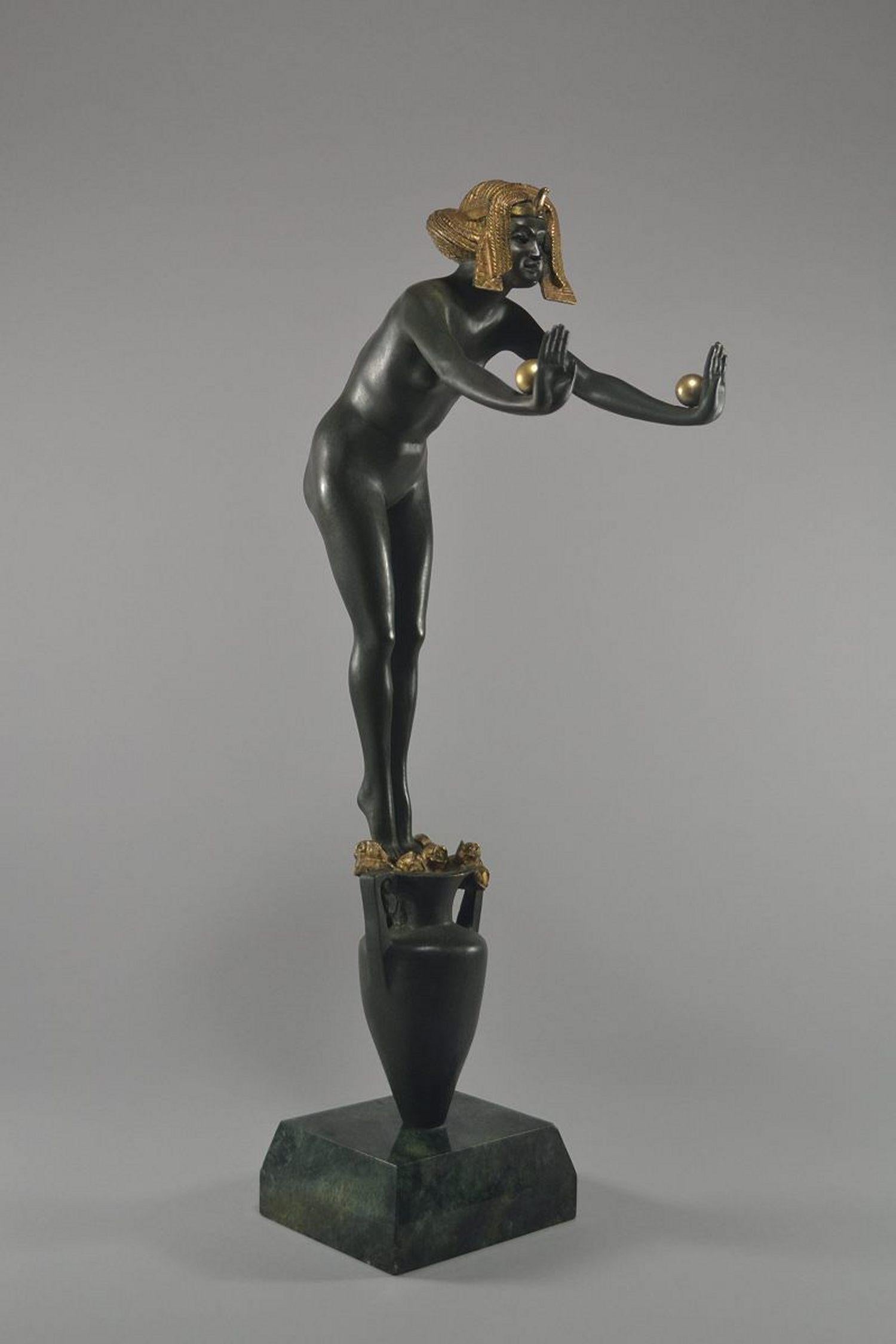 Claire Jeanne Roberte Colinet (1885-1972)

Egyptian Dancer'

A large patinated bronze figure, circa 1925
Modeled as a nude female in gilt Egyptian head dress, standing on an amphora vase, posed lent forwards with arms outstretched balancing two