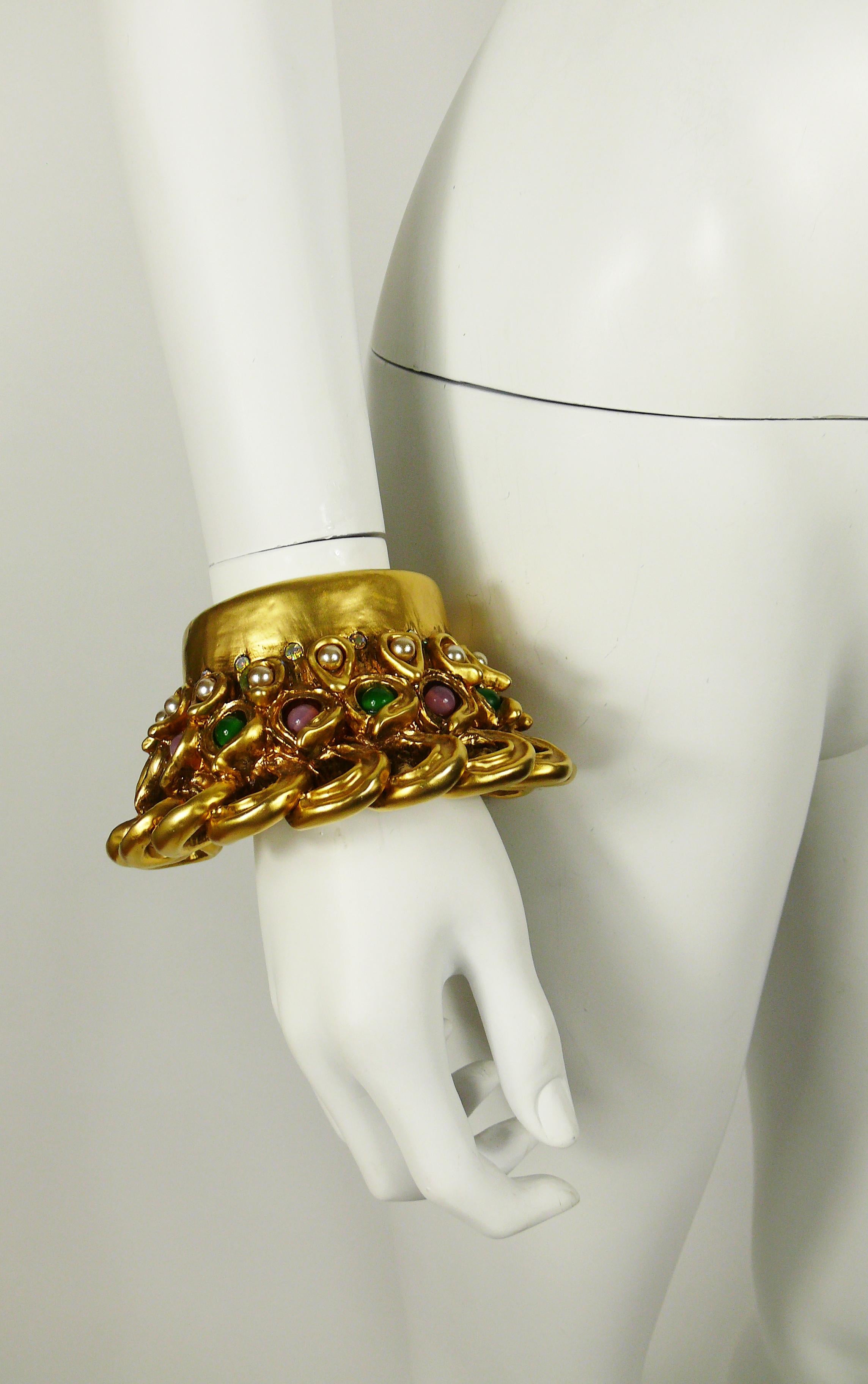 CLAIRE DEVE vintage massive gold toned resin cuff bracelet embellished with multicolored glass beads, faux pearls and crystals.

Embossed CLAIRE DEVE Paris.

Indicative measurements : inner circumference approx. 17.91 cm (7.05 inches) / max. width