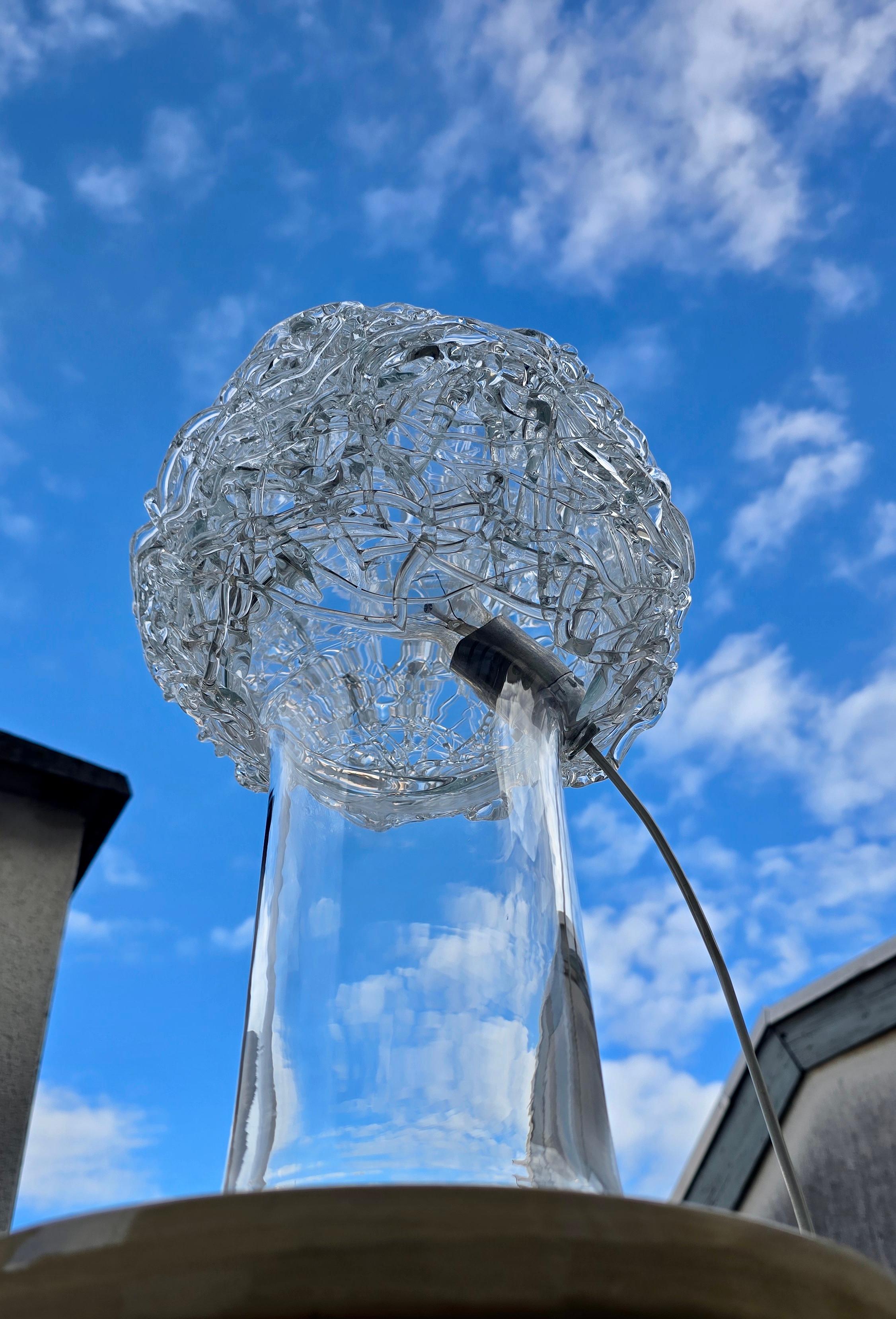 Attributed Claire Falkenstein table lamp for Salviati, featuring a hand formed spun glass dome over a mouth blown crystal glass cylinder base. Italy, circa 1970s.

This rare table lamp is attributed to the American sculptor Claire Falkenstein for