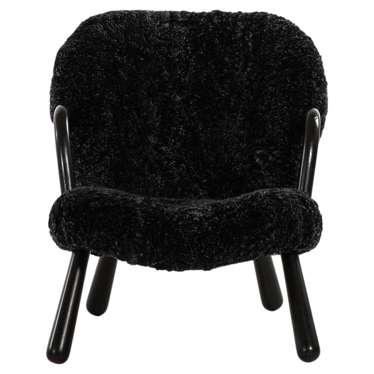 Clam Easy Chair in Black Colored Wood and Sheepskin by Arnold