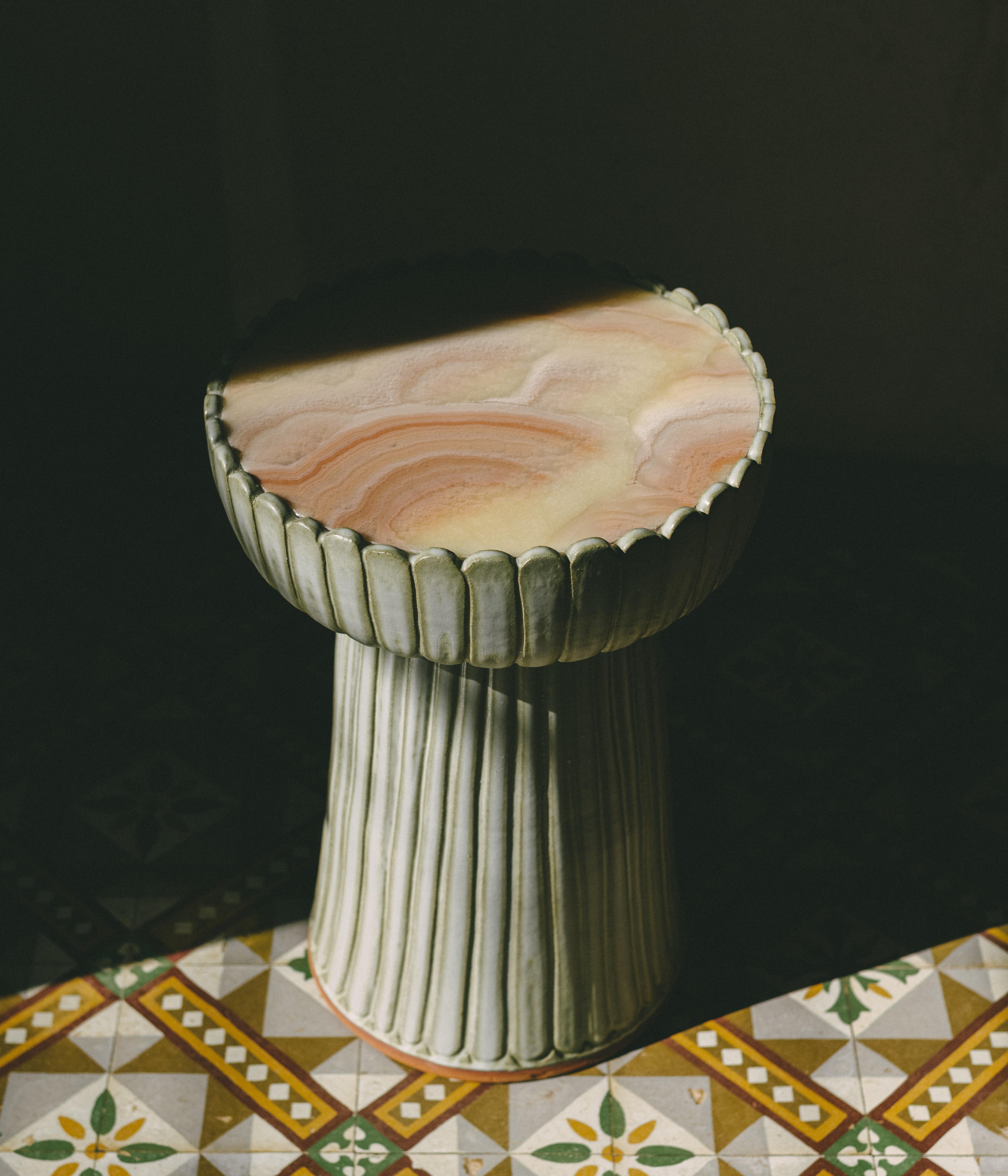 Clam Pink Onyx Auxiliary table by Casa Alfarera
Dimensions: D40.6 x H55.9 cm 
Materials: Petalite saturated, iridescent and irregular glaze

The Clam Auxiliary table is our latest creation in ceramic furniture. It is a continuation of Casa