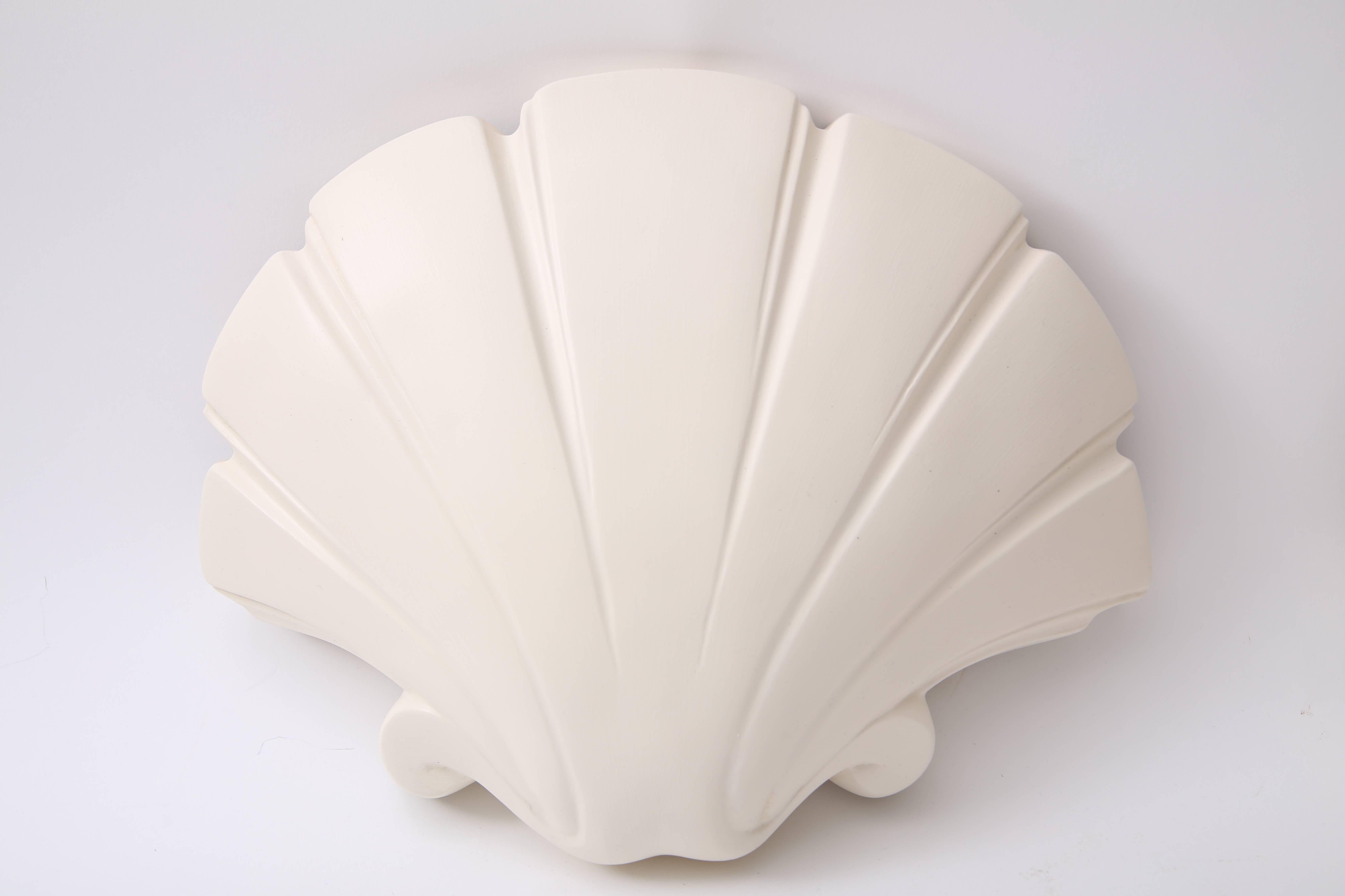 This pair of clamshell-form wall sconces were created by Sirmos and date to the 1970s-1980s. 

Note: These have been professionally rewired and require two candelabra-base bulbs each.

Note: These have been professionally repainted.


 