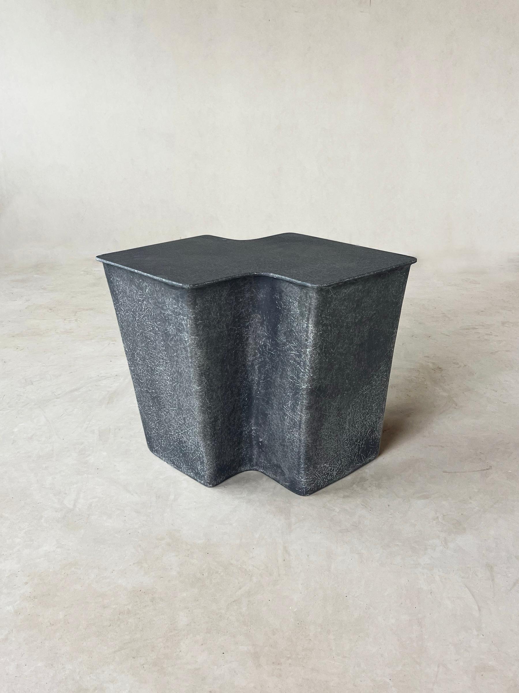 The artisanal process of creating our Clam Side Table gives each piece an individual soul and patina, as the temperature, humidity and hands at work all contribute to its distinctiveness. 

It is a reaction to the mass-produced and industrial,
