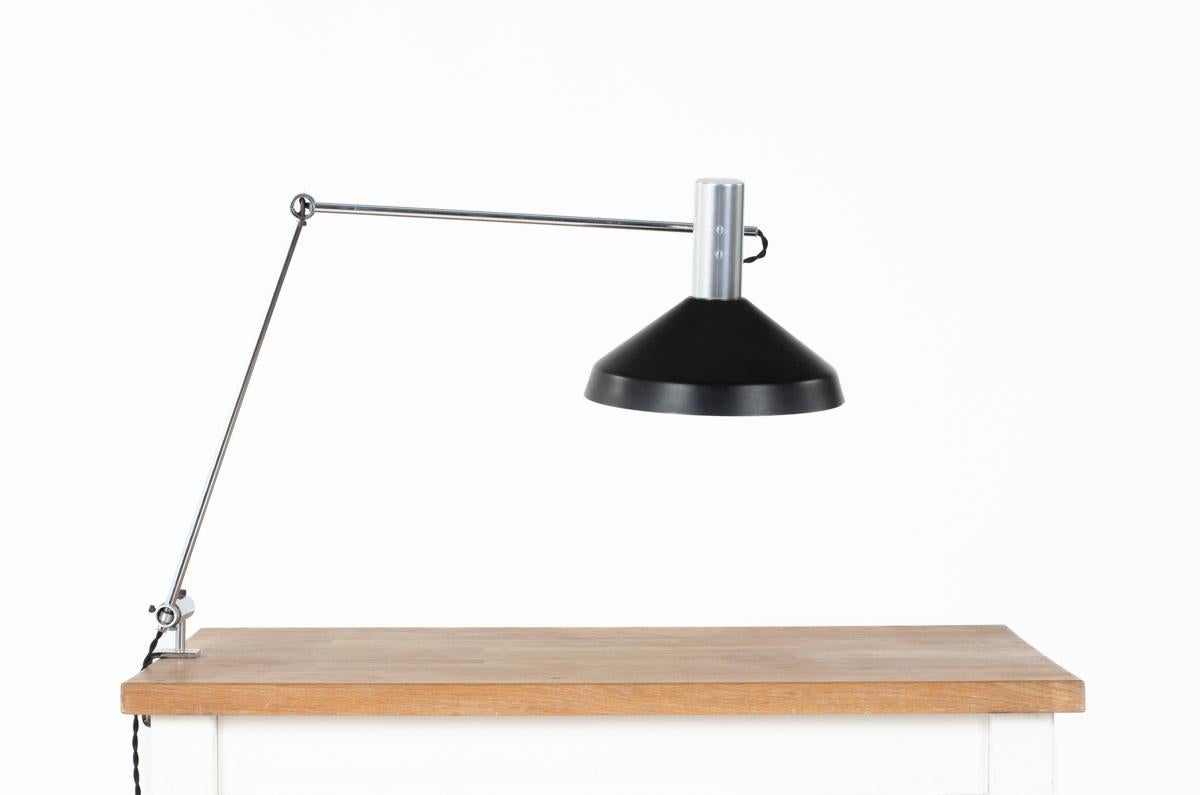 Clap lamp by Rose-Marie and Rico Baltensweiler in the 60s
Vice attachment, 3 adjustable arms, round reflector all in chrome and black lacquered metal
Switch on the top of the reflector
Adjustable in all positions.
  