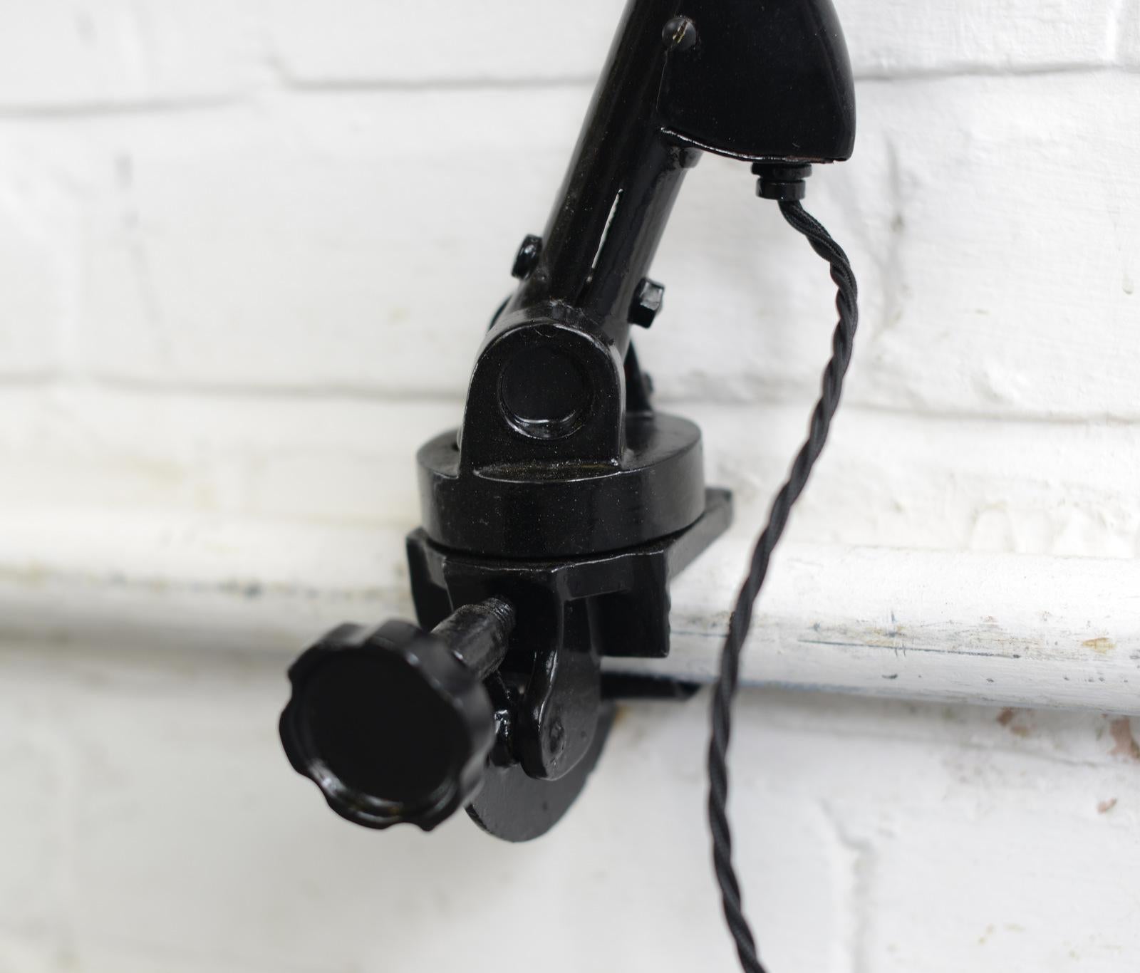 Clamp on architects lamp by Siemens, circa 1930s

- Vitreous black enamel shade
- Siemens logo on the inner shade
- Turns 360 and is fully articulated
- German, 1930s
- Shade measures 18cm wide
- Extends up to 100cm tall

Condition