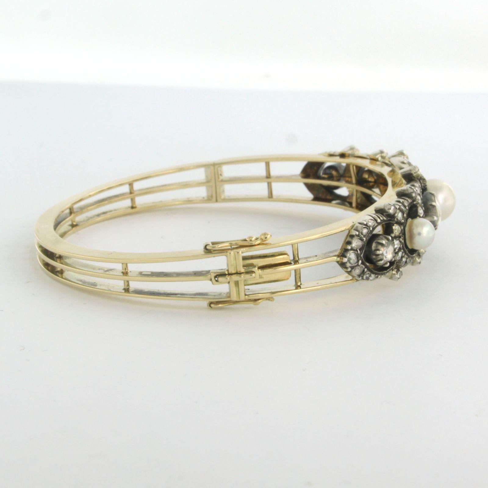 Clamper Bracelet set with pearls and diamonds 14k yellow gold and silver For Sale 1