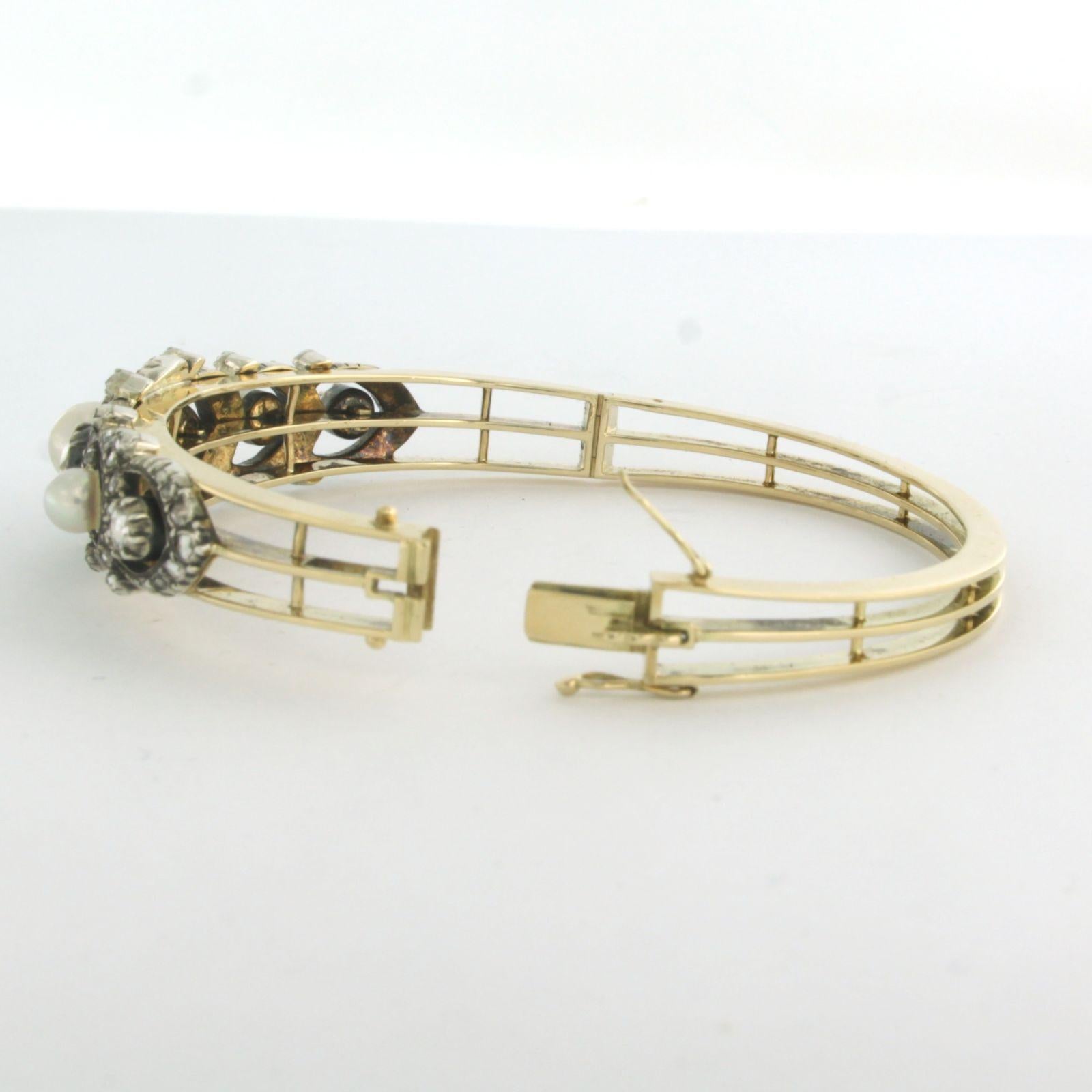 Clamper Bracelet set with pearls and diamonds 14k yellow gold and silver For Sale 2