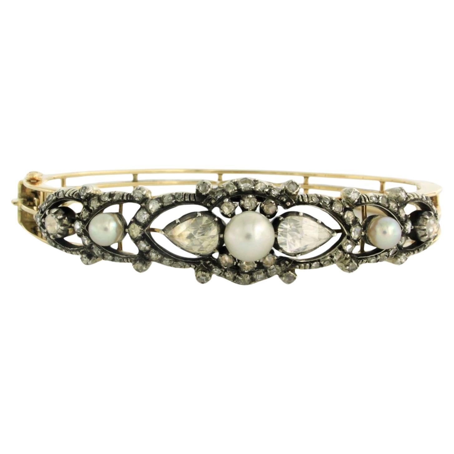 Clamper Bracelet set with pearls and diamonds 14k yellow gold and silver For Sale