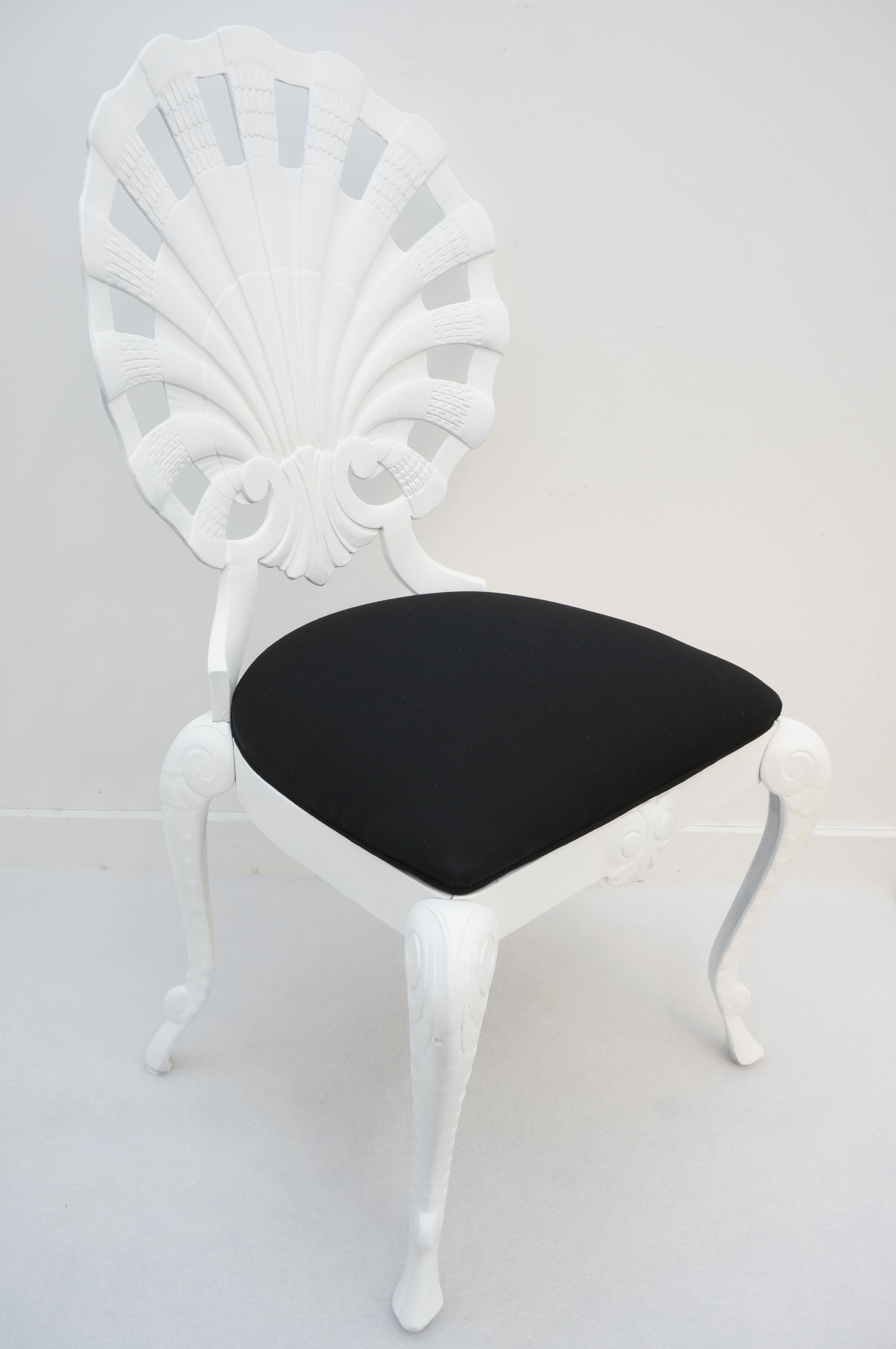 This styish grotto, clamshell side chair will make a statement with its form and give your garden or home a Hollywood Regency vibe.

Note: The piece has been professioanlly painted in a matte white and reupholsterd with black sunbrella fabric.

 
