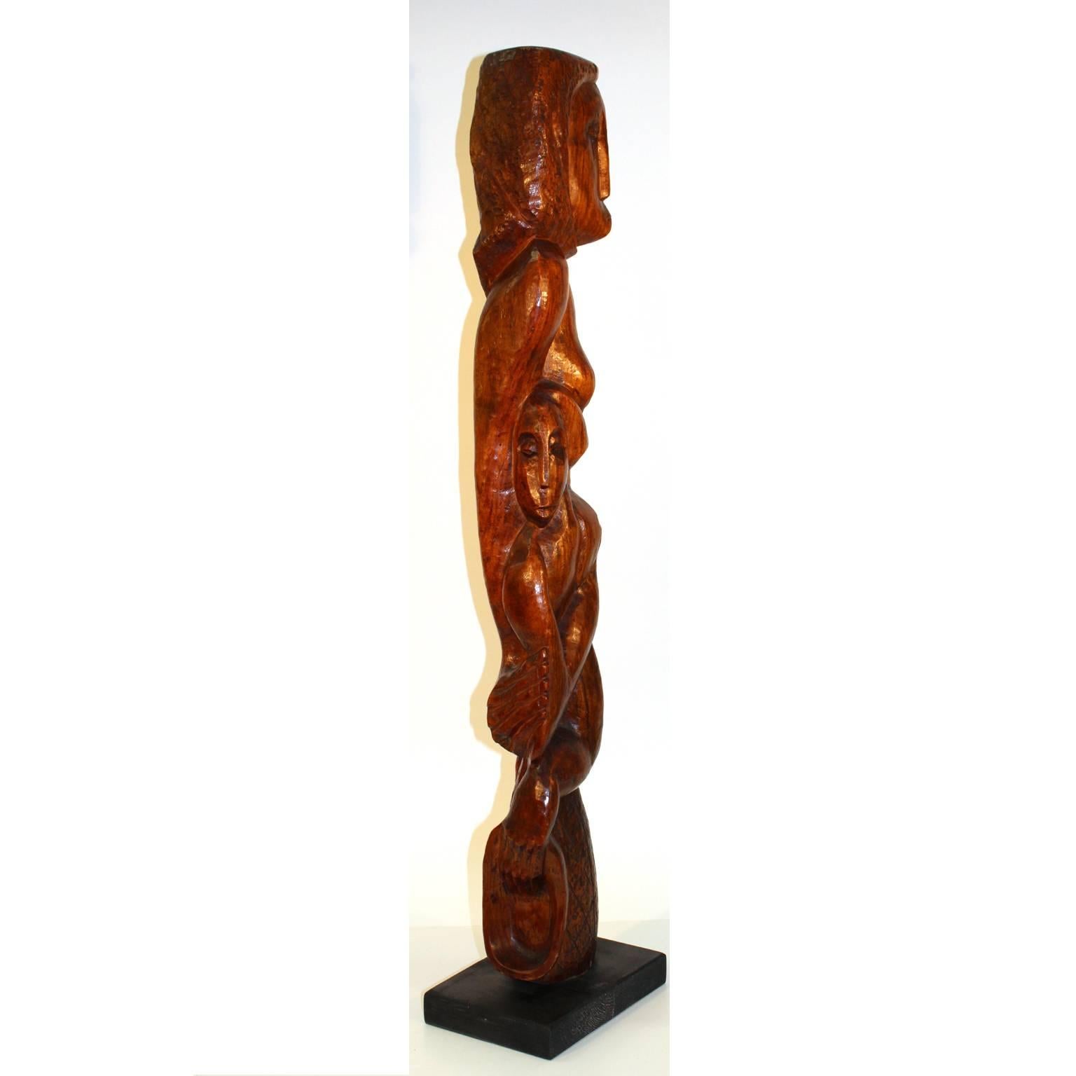 An African School carved wood sculpture made in the 1940s (circa 1940) by U.S. artist Clara Shainess and mounted on a painted wooden base. Good condition, some age cracks and chips; signed 'Shainess' in wood.