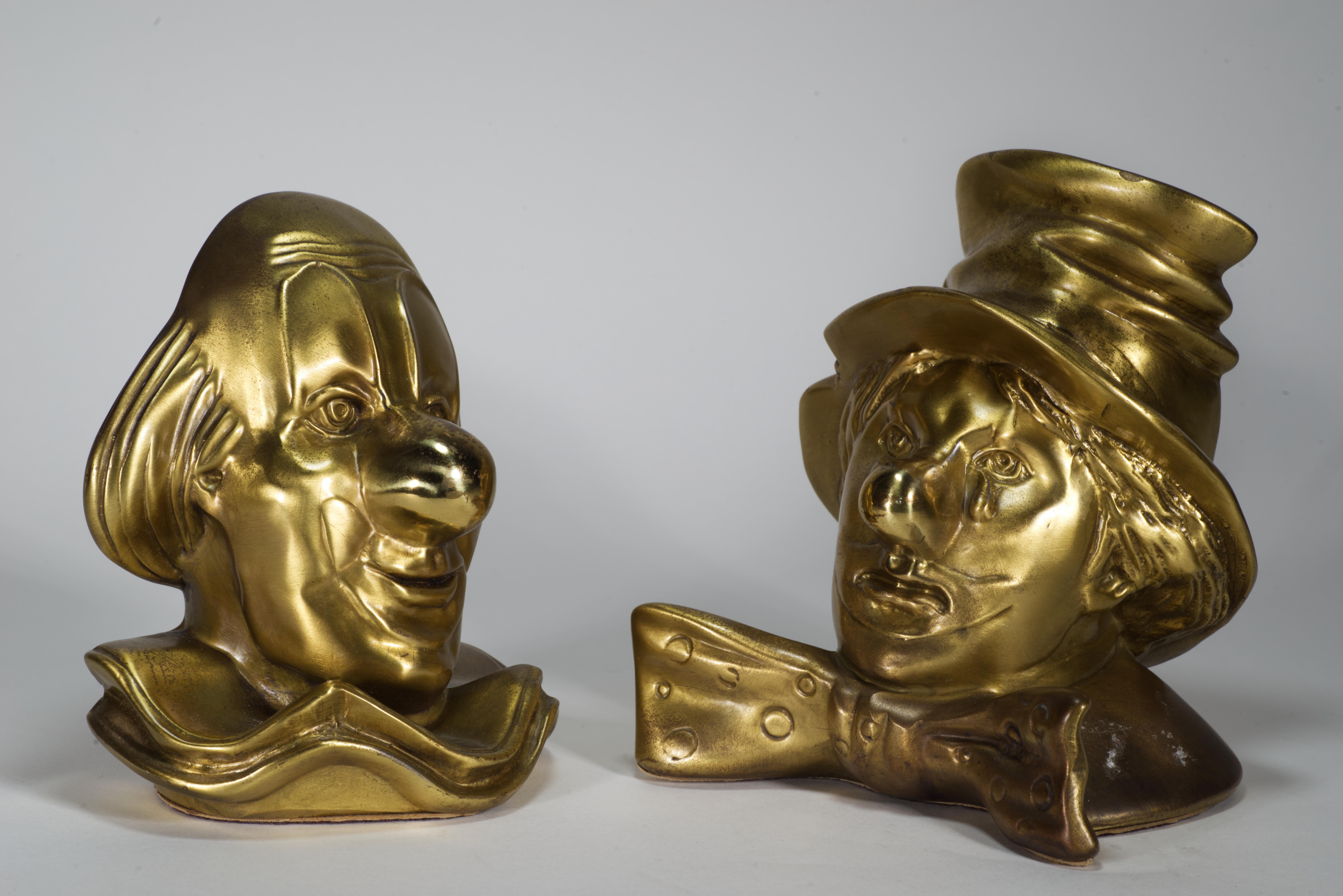  The set features two bookends shaped like clowns, with the character Clarabell and Emmet Kelly. The bookends have beautiful, age-appropriate patina; they are marked with manufacturer's stickers PM Craftsman, Eaton Park, Florida, on the felt