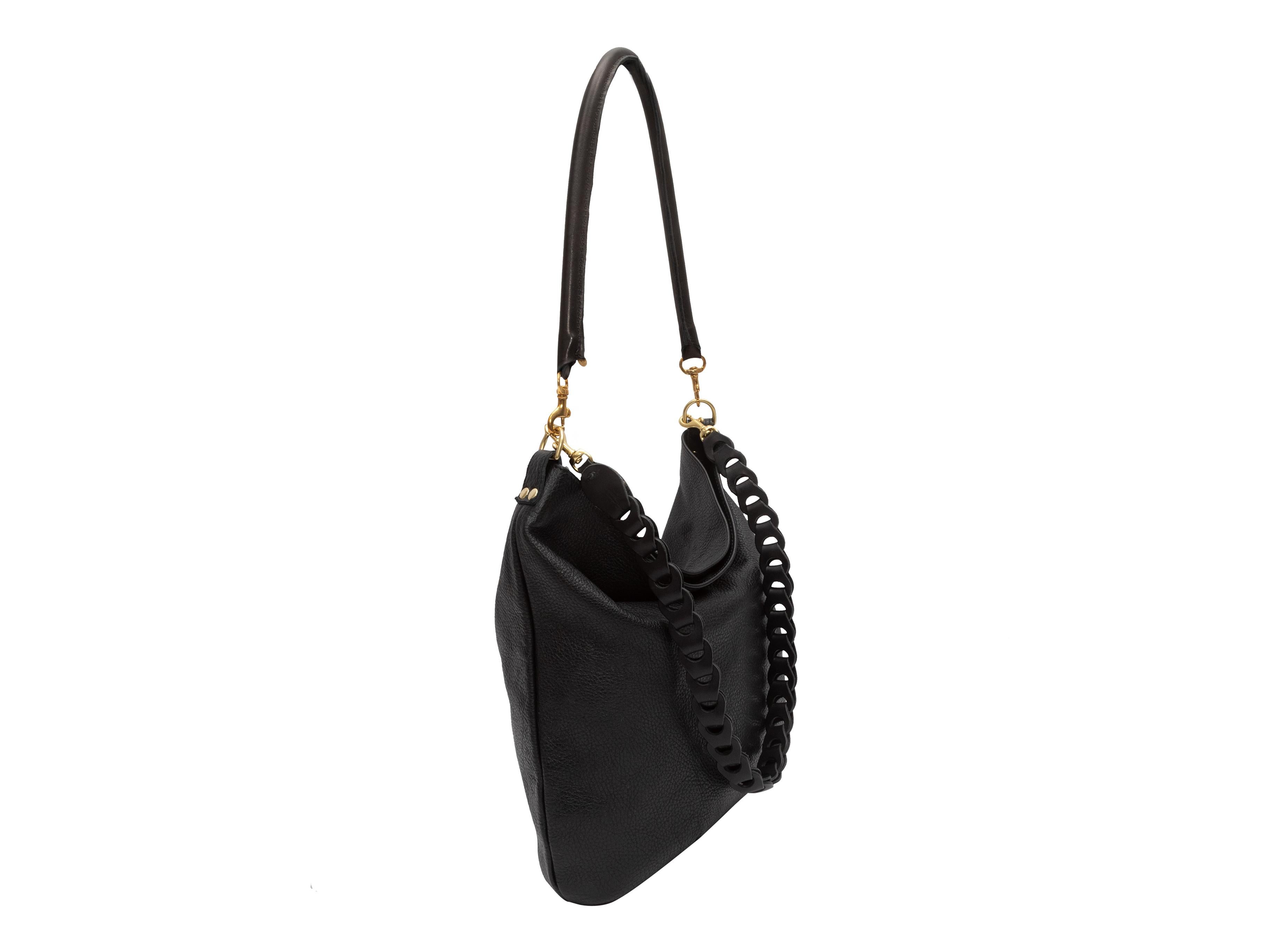 Product Details: Black Clare V. Leather Hobo Bag. This bag features a leather body, gold-tone hardware, and dual shoulder straps. 12