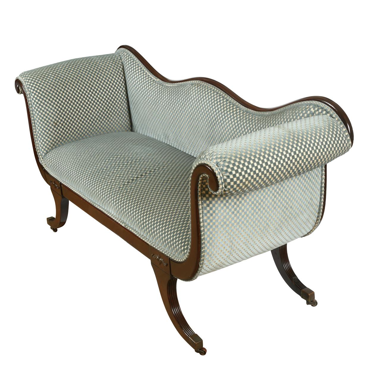 Clarence House blue velvet upholstered Recamier sofa with curved wood frame.